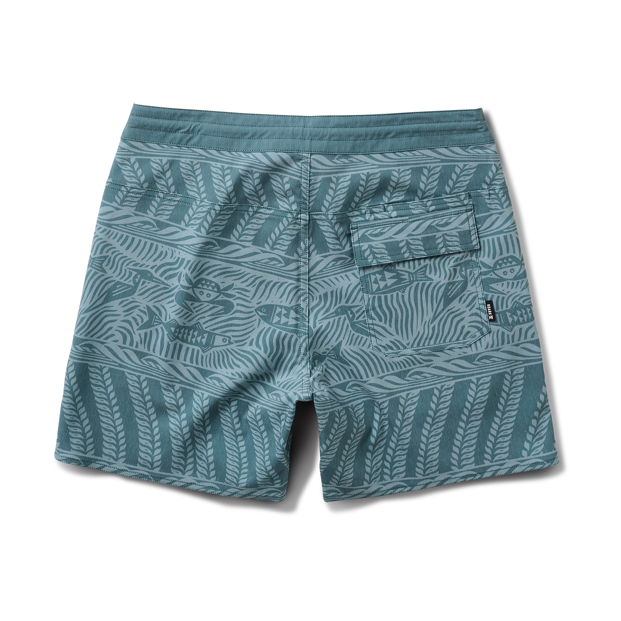 Roark stylish boardshorts on a sandy beach, ideal for adventure and travel