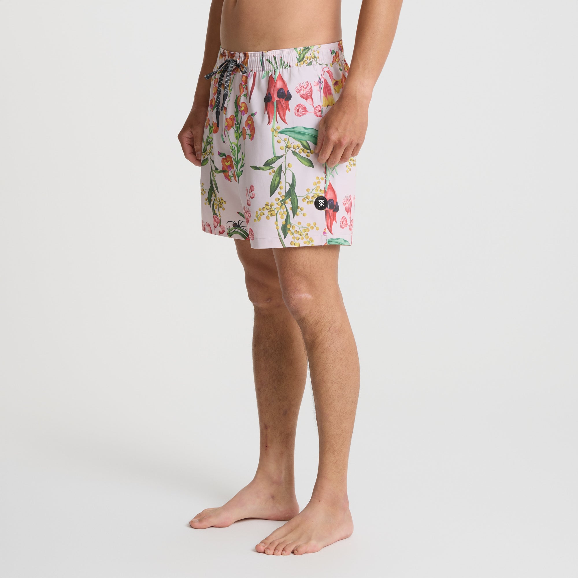 Assorted Roark boardshorts and swim trunks designed for adventure and leisure activities, displayed in an outdoor setting.