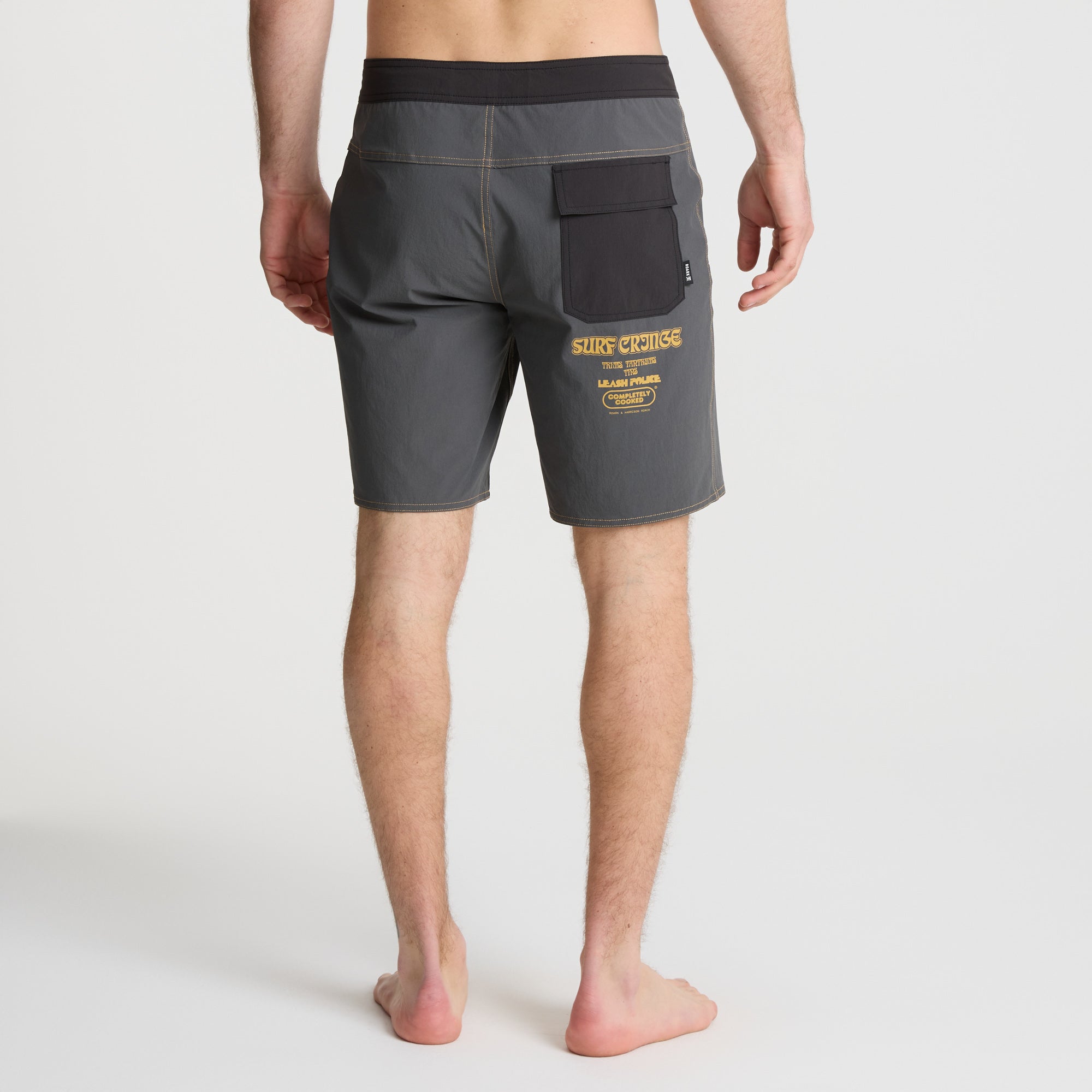 Versatile boardshorts ideal for travel and outdoor activities, featured in a gray scale tropical pattern, perfect for any adventure.