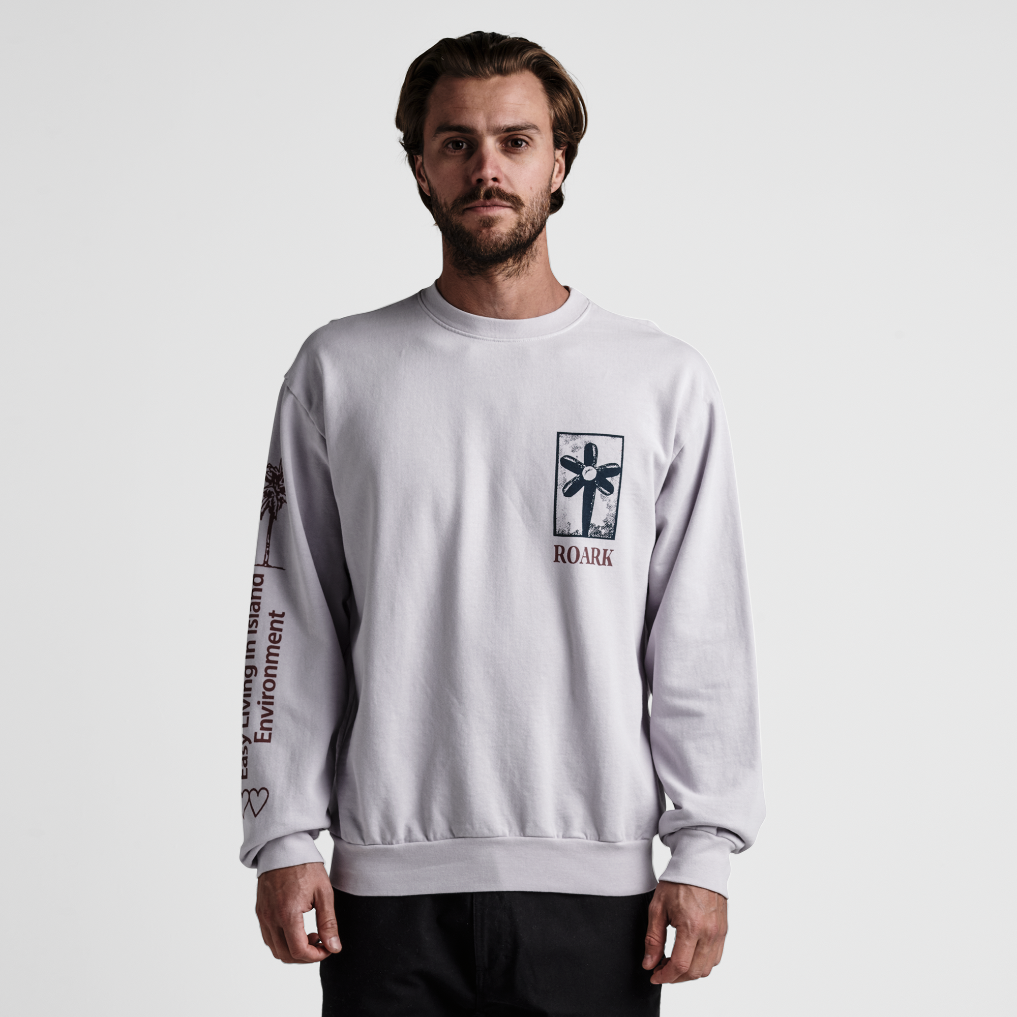 The model of Roark men's Artifacts Of Adventure Crew Sweatshirt - Dusty Lilac