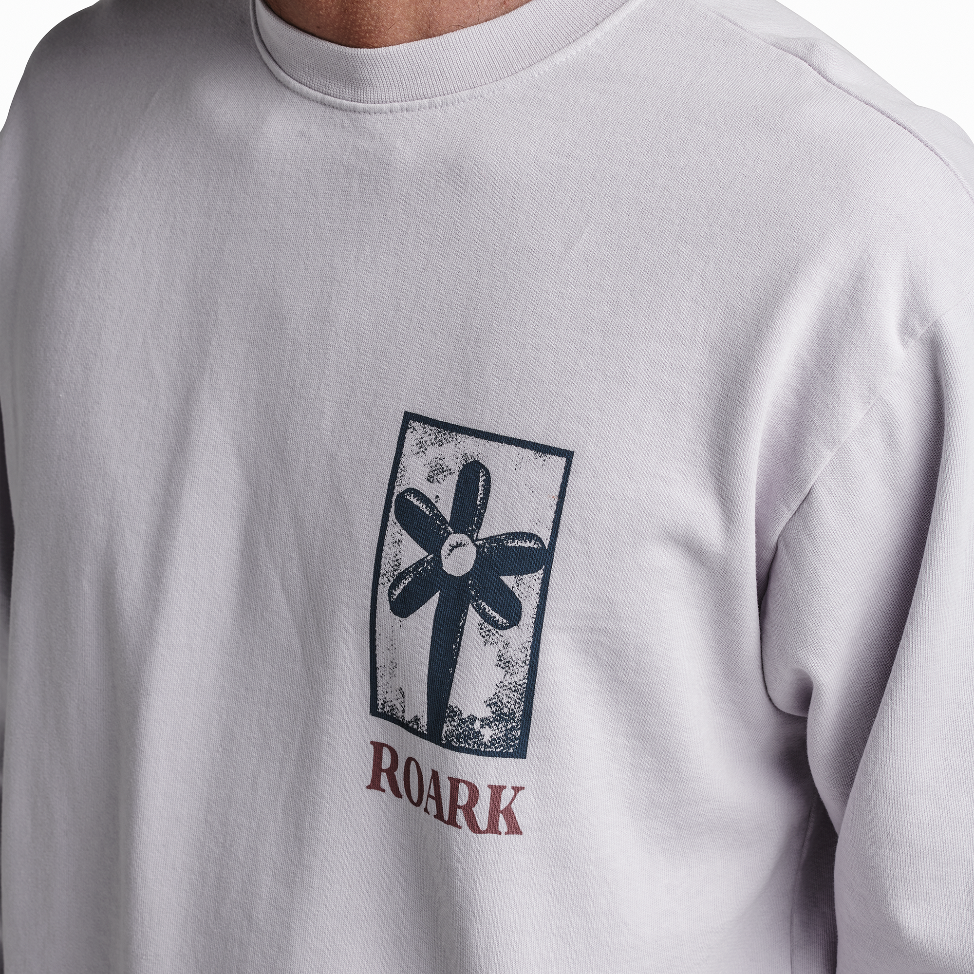 The model of Roark men's Artifacts Of Adventure Crew Sweatshirt - Dusty Lilac