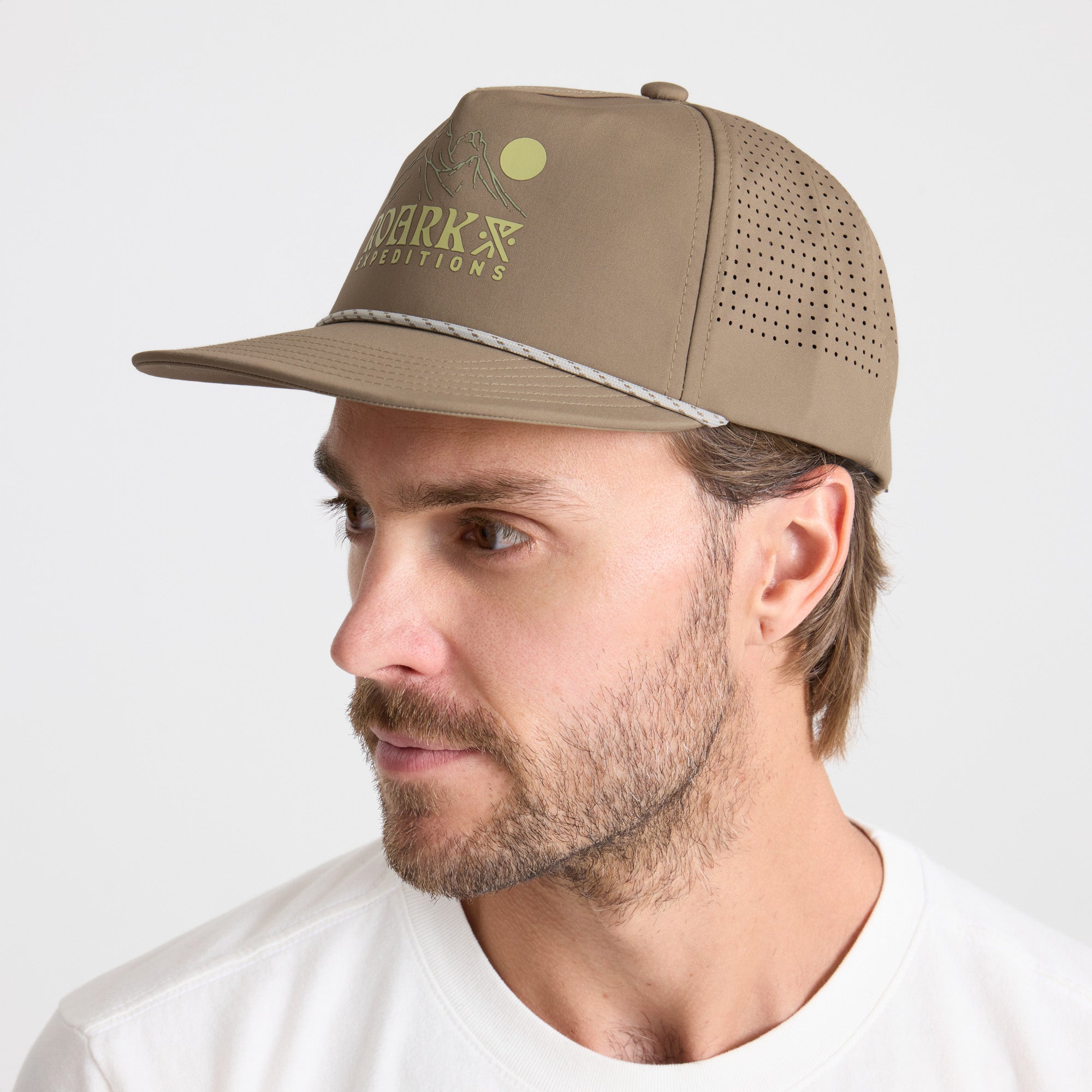 Versatile outdoor adventure cap in khaki, ideal for sun protection on Roark's epic journeys and exploration trips.