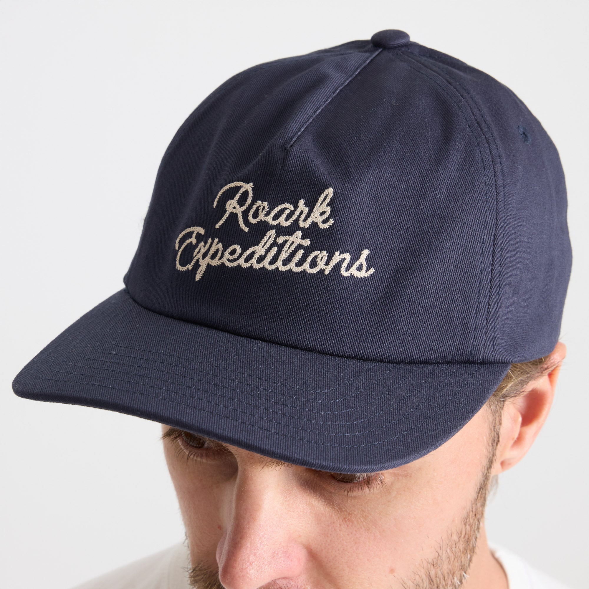 Stylish navy blue baseball cap perfect for outdoor adventures and travel, part of Roark's gear collection.