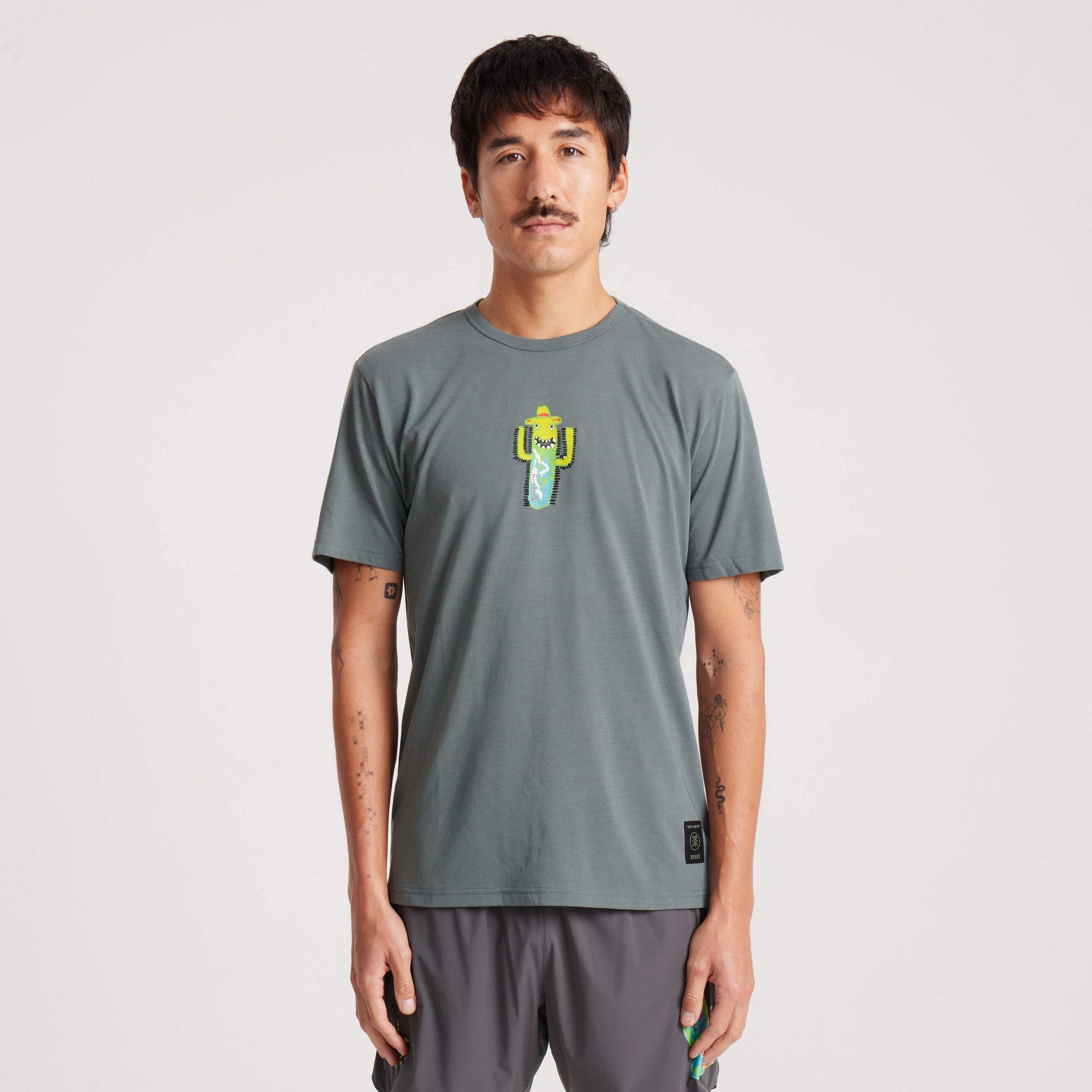 Green graphic tee with a fun cactus print, featuring a relaxed fit and crew neckline for everyday comfort and style.