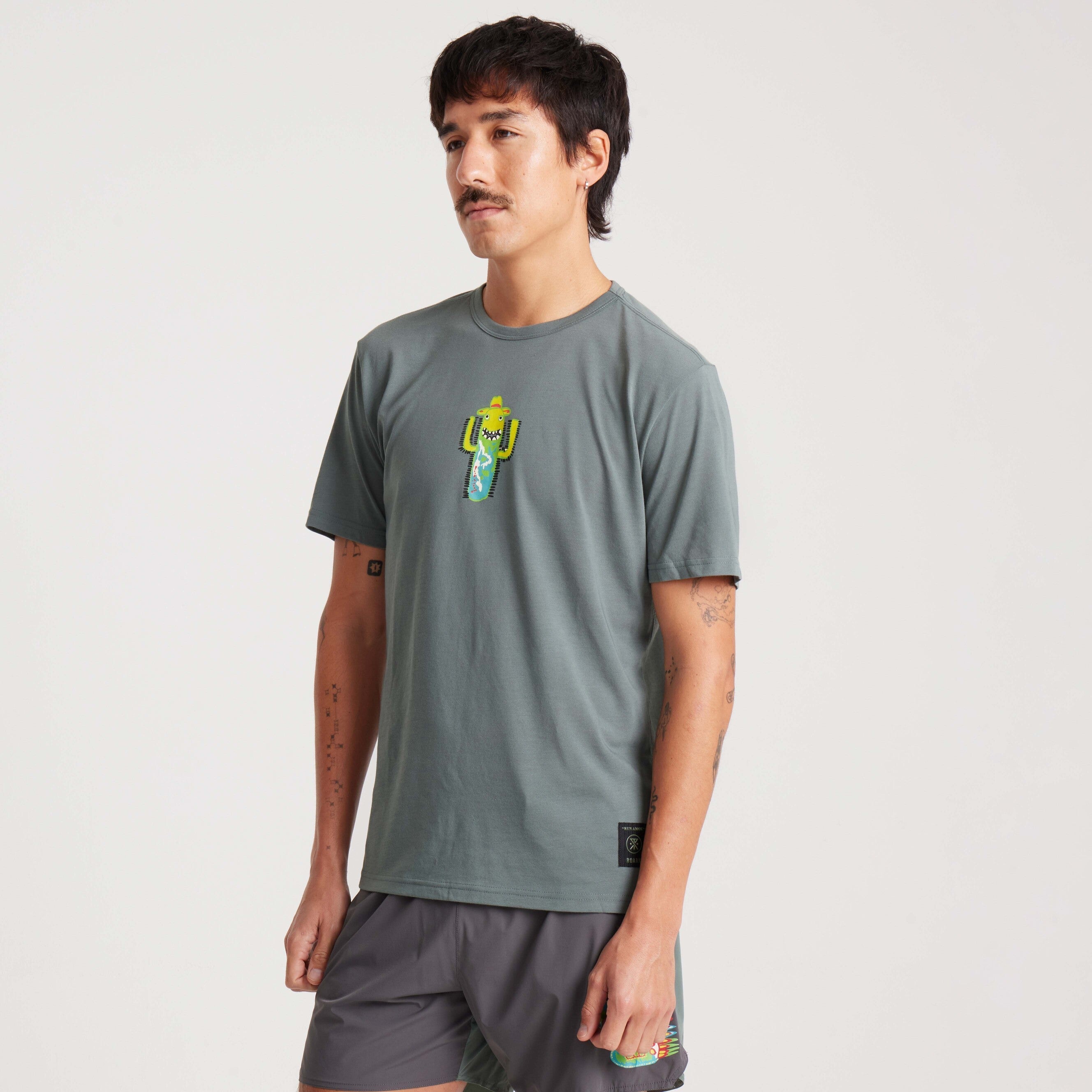 Stylish green graphic tee with cactus print, perfect for casual outings or relaxed days at home.