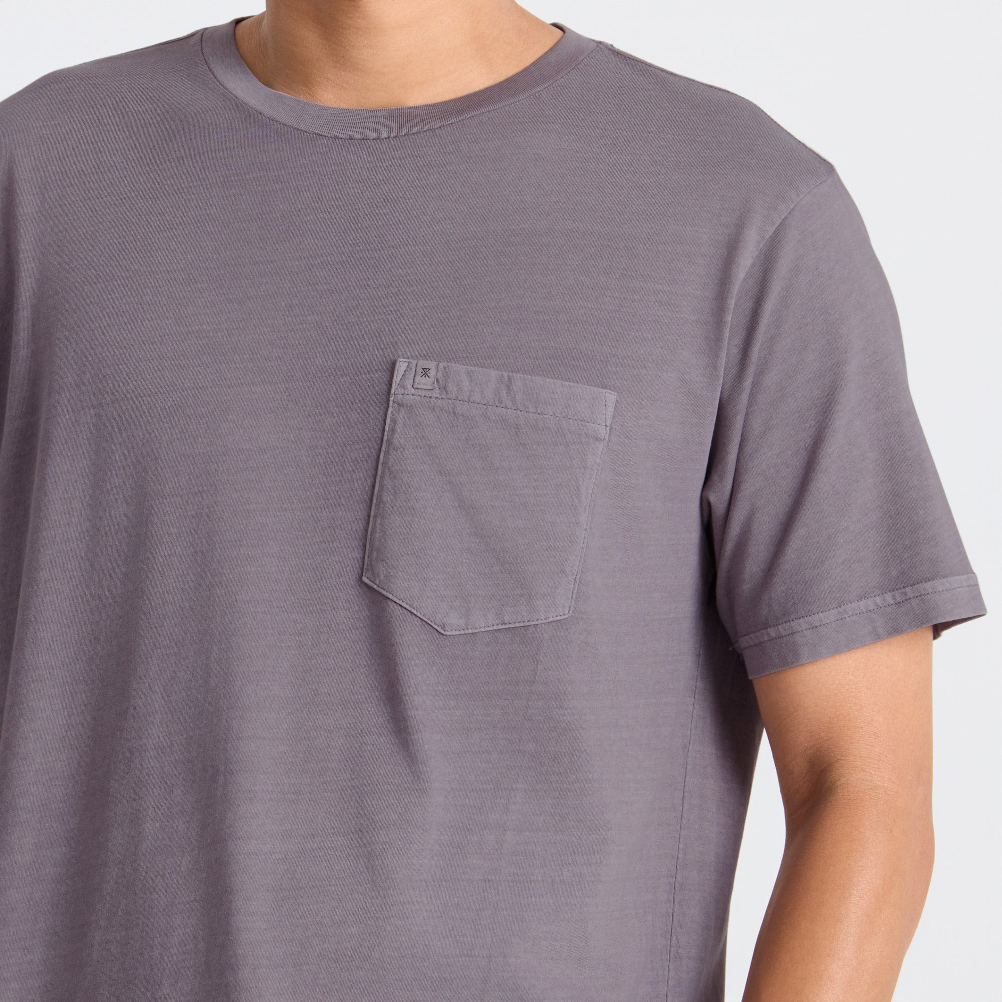 Gray t-shirt with a pocket on a white background