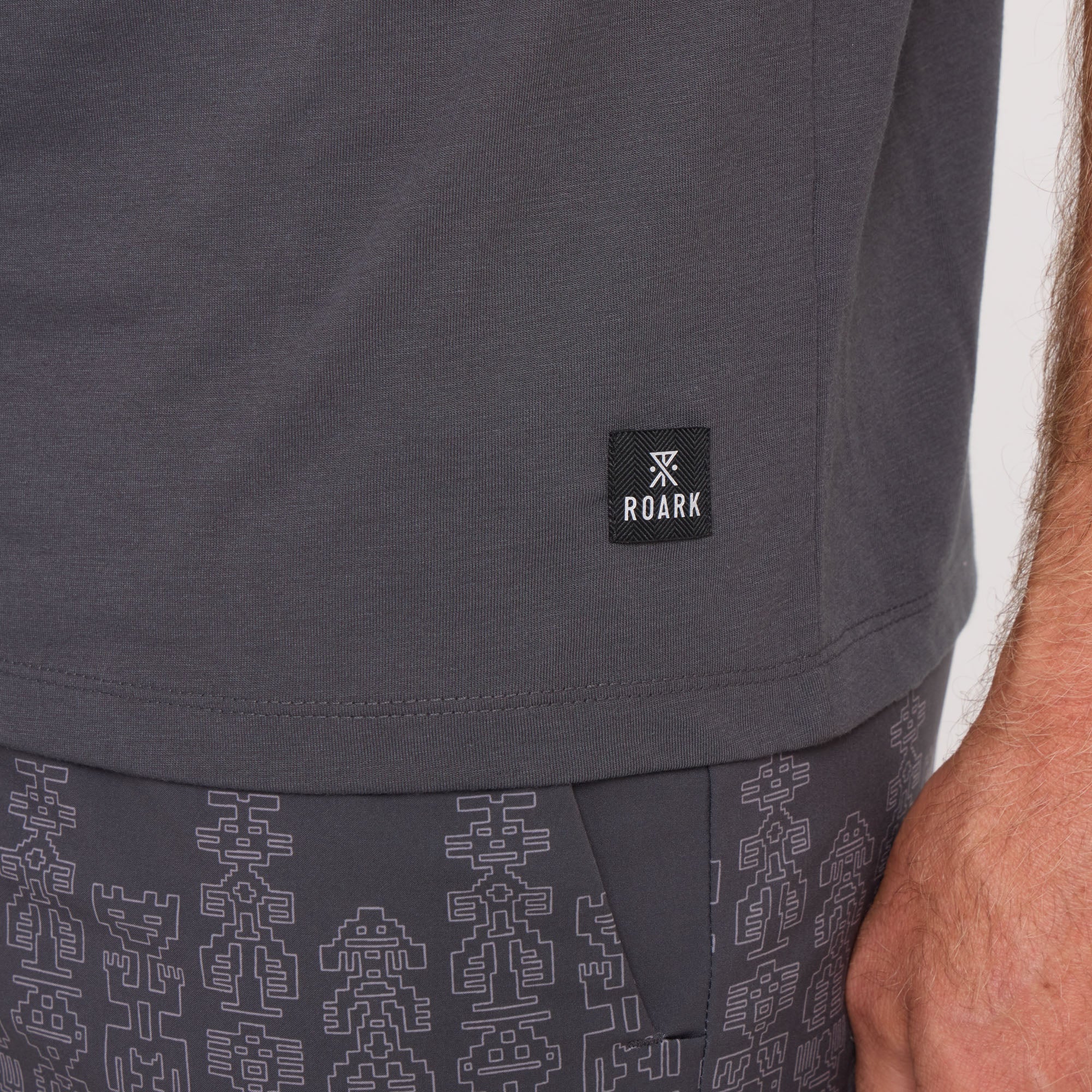 Grey active shirt designed for adventure, perfect for travel and outdoor activities by Roark.