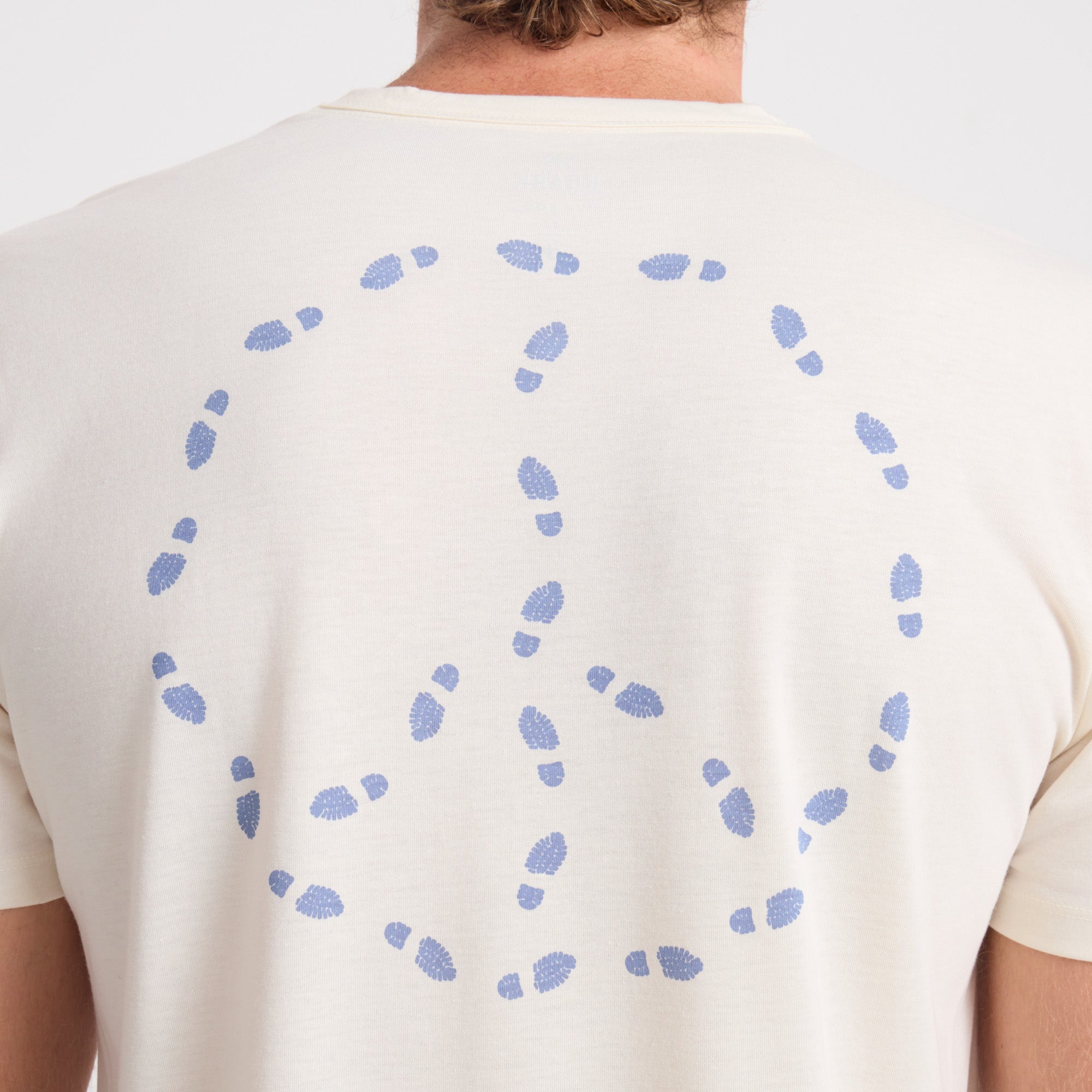 Adventurous traveler exploring scenic outdoor location with Roark gear.