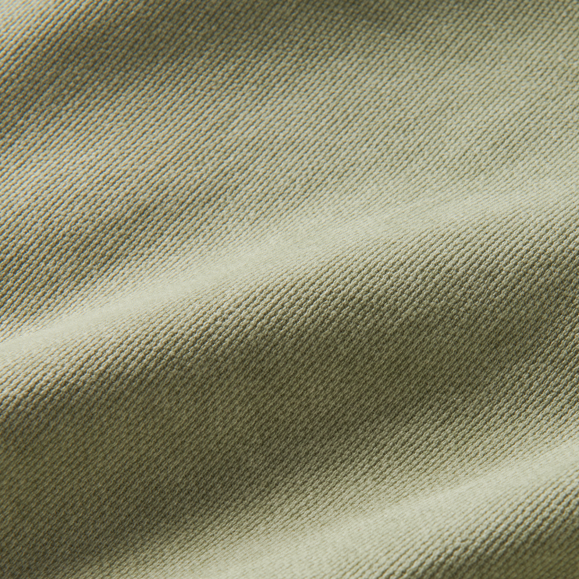 Close-up of high-quality woven linen fabric, showcasing the texture and natural appeal perfect for outdoor and travel gear by Roark.