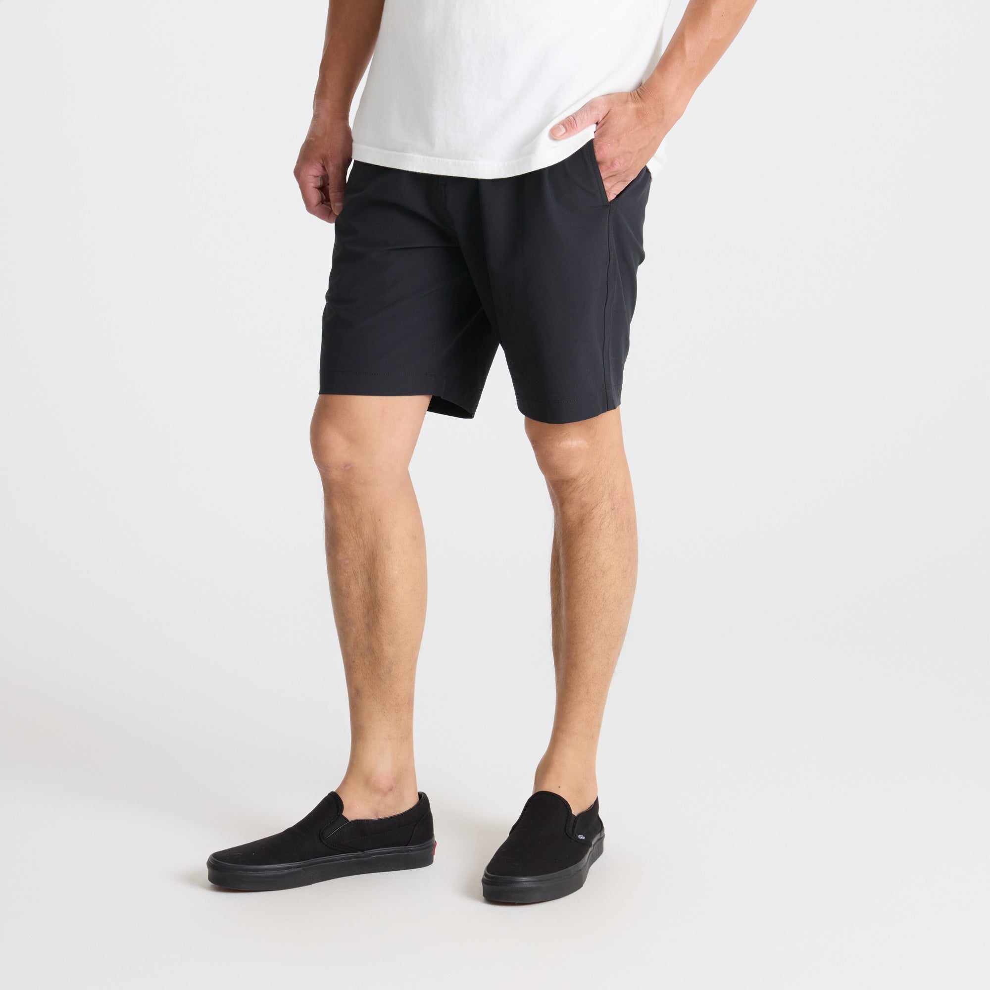 Versatile black Bermuda active shorts by Roark, ideal for outdoor adventures and travel, extending to the knee with a comfortable fit.