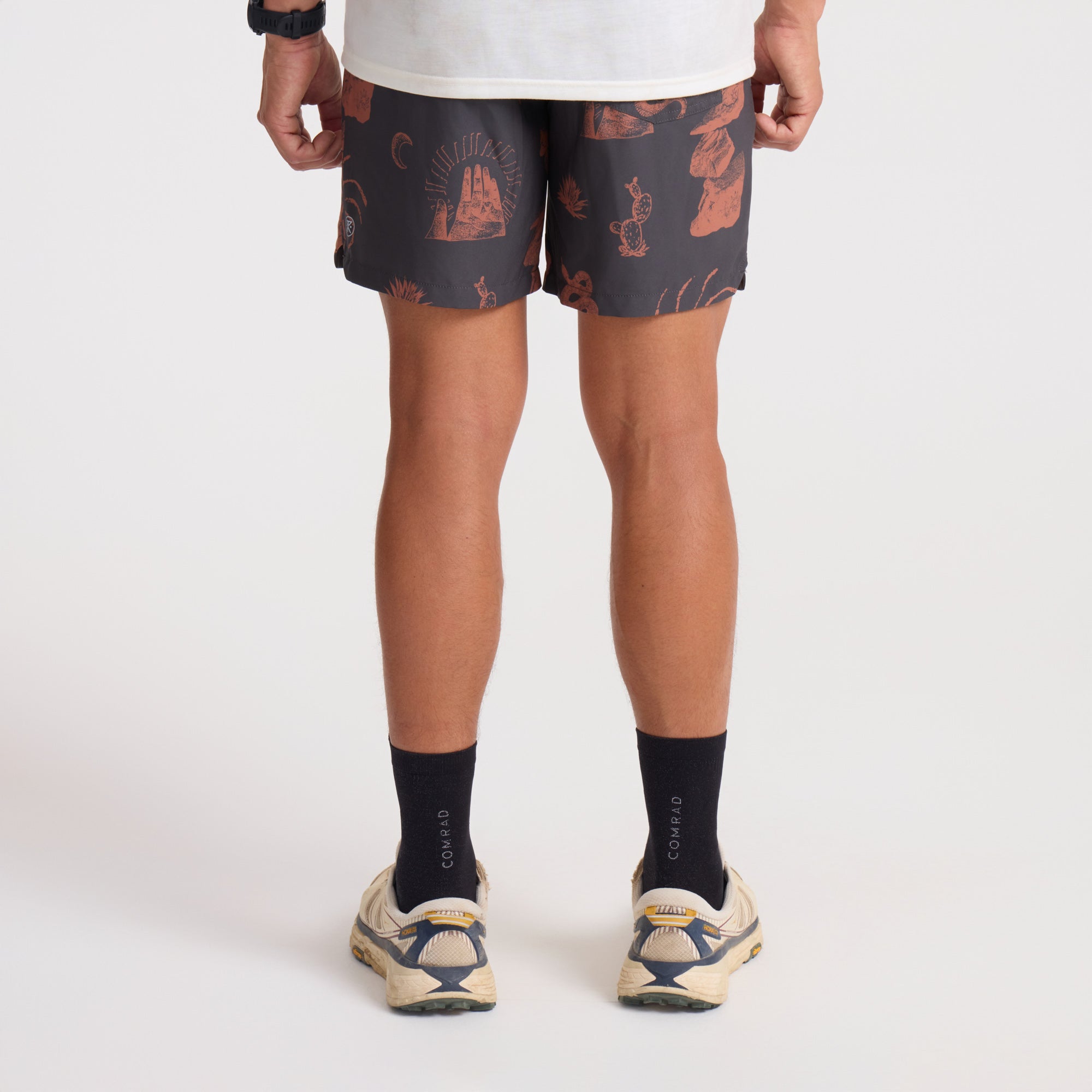 Close-up of Roark's adventure-ready boardshorts in vibrant orange and earthy brown, perfect for active and outdoor lifestyles.