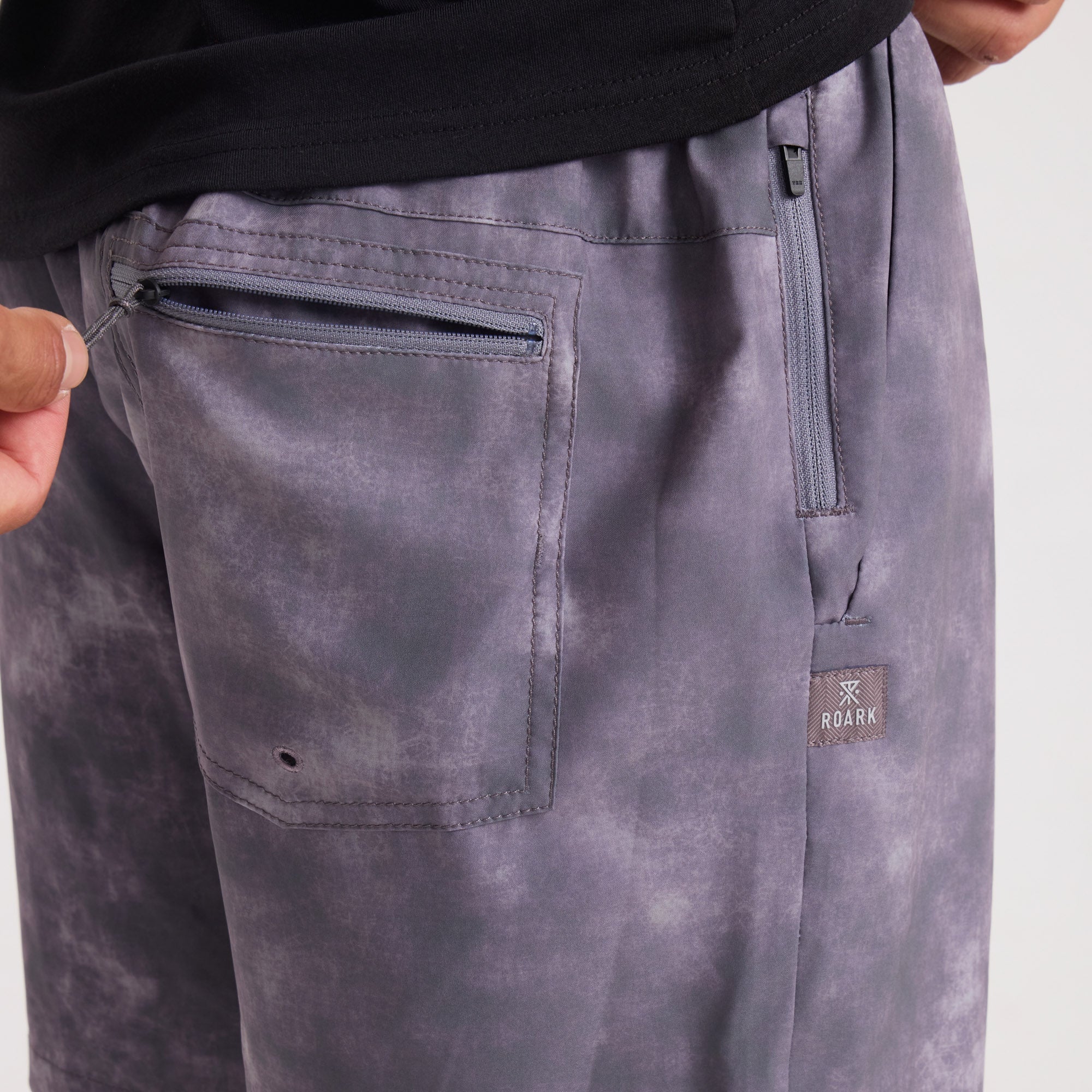 Grey and silver leather pocket accessory, ideal for adventure and travel essentials, by Roark.