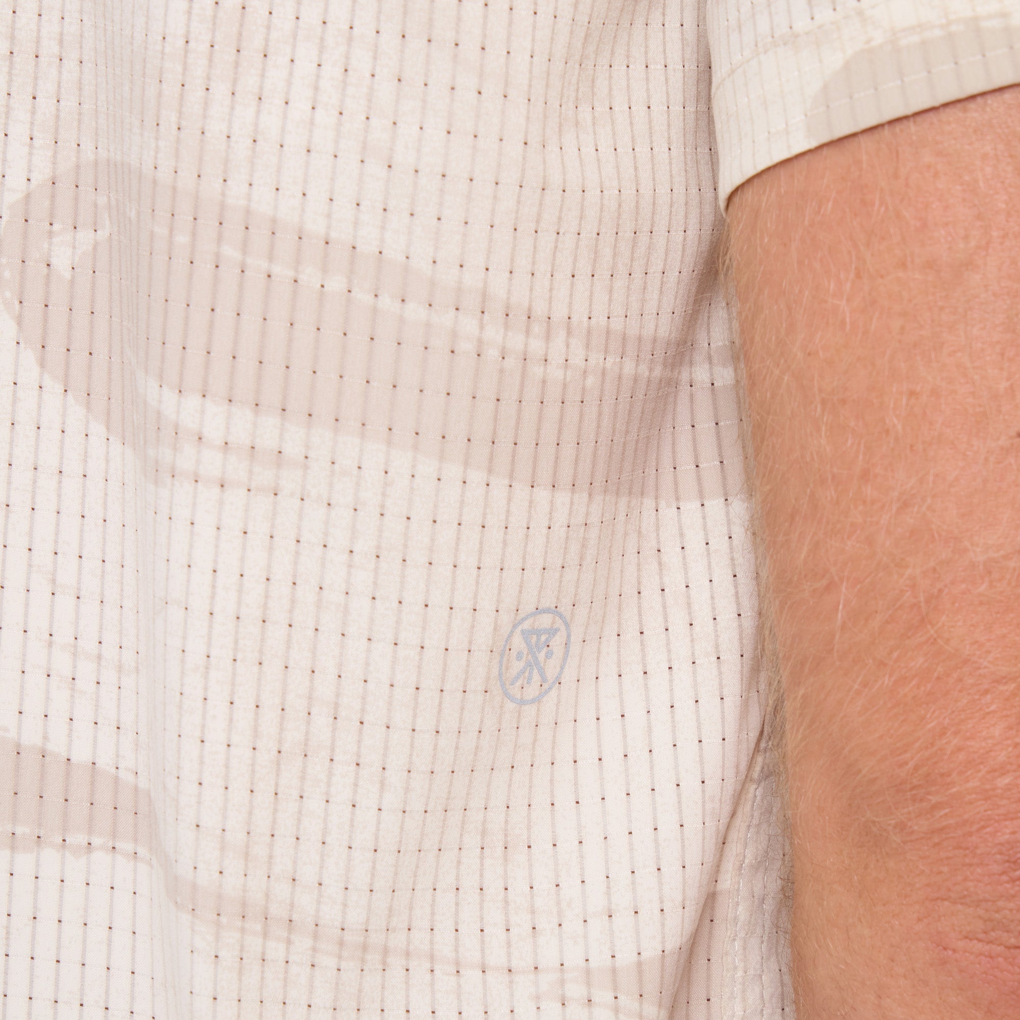 Roark adventurer exploring rugged terrain in durable outdoor gear.