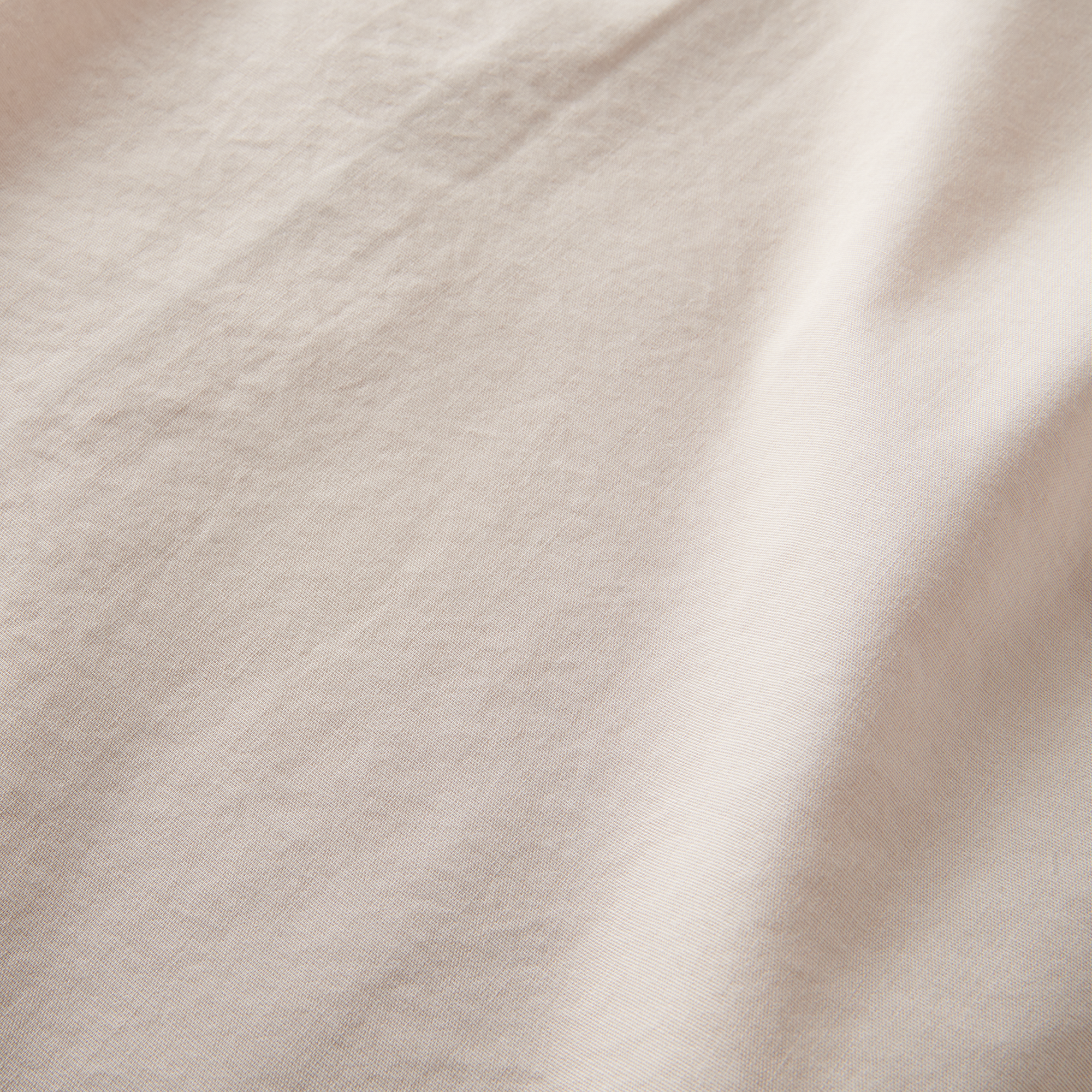 Detailed texture of the Roark Made To Fade Short Sleeve Button Up Shirt in Washed Bone, highlighting its breathable and soft fabric.