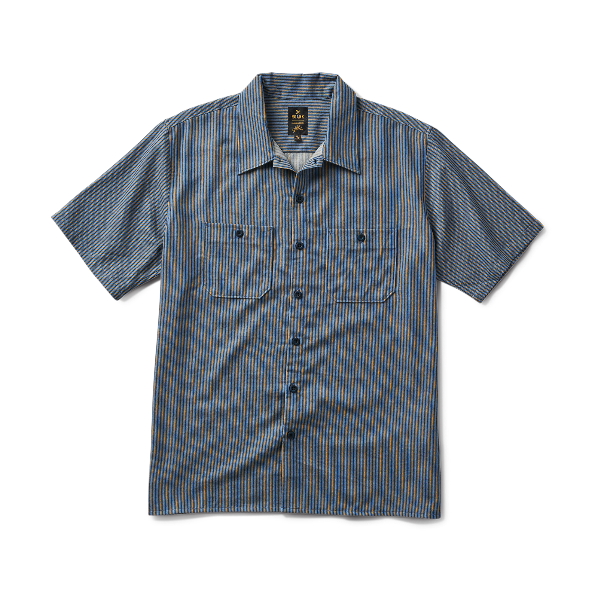 Close-up view of an active shirt by Roark, featuring detailed collar, sleeve, and button design, perfect for adventure and travel.
