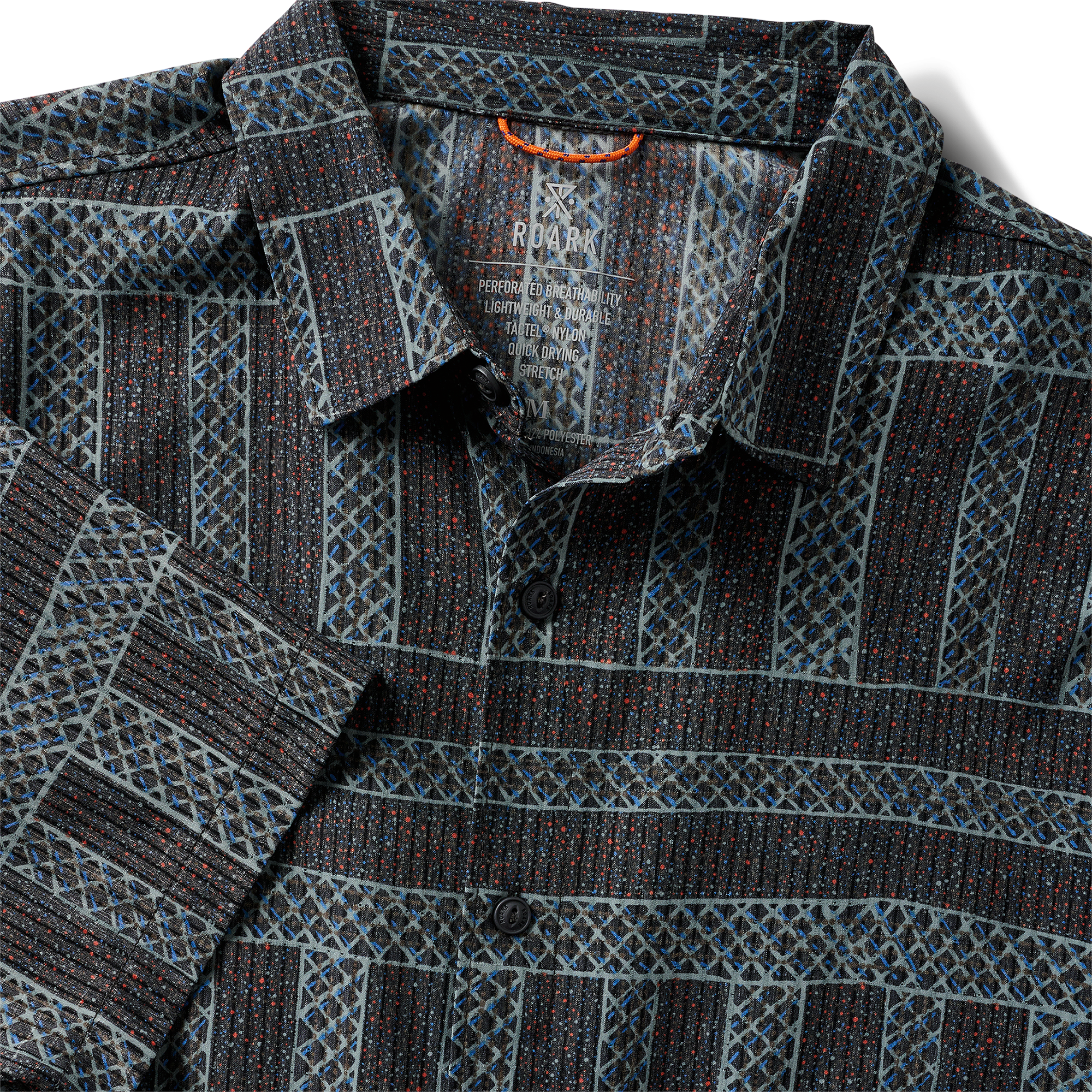 Close-up of the collar and buttons of a geometric-patterned shirt, highlighting texture and design details.