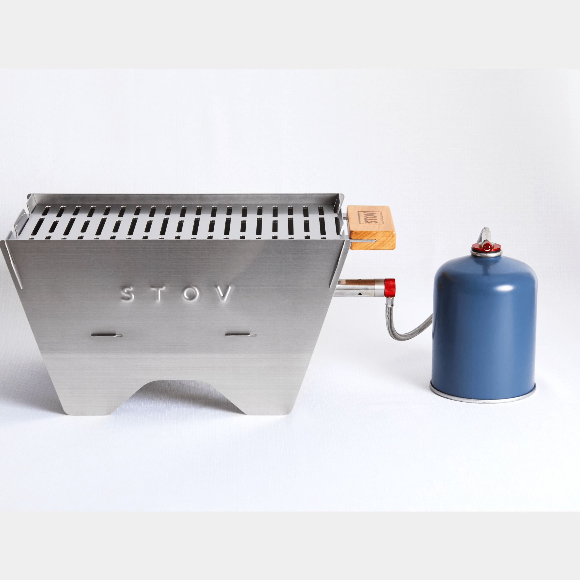 STOV Portable Gas BBQ connected to gas bottle