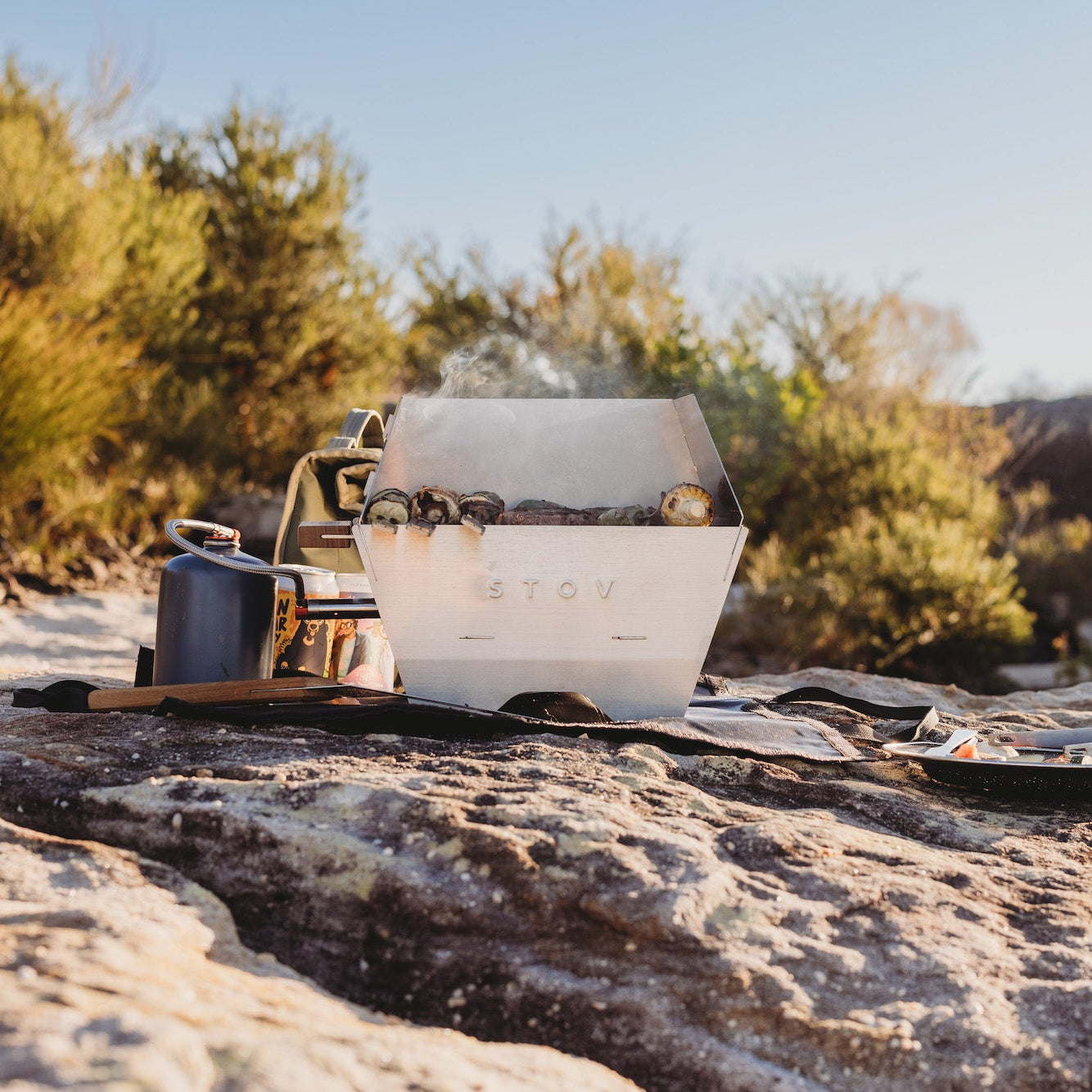 STOV BBQ and windshield cooking along while camping in the sun