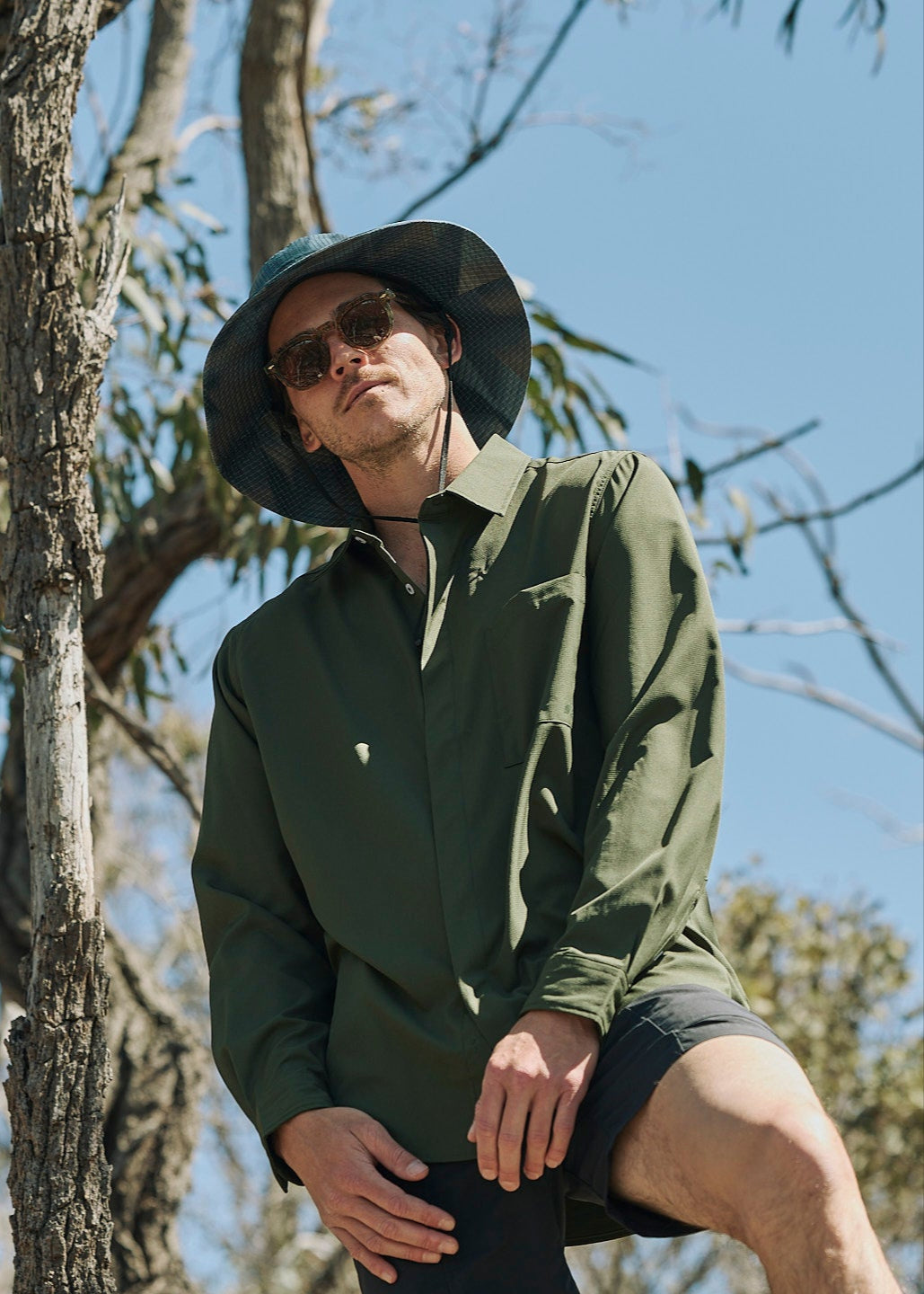 Person wearing olive green Sun Ray UPF50+ sun protection sun shirt