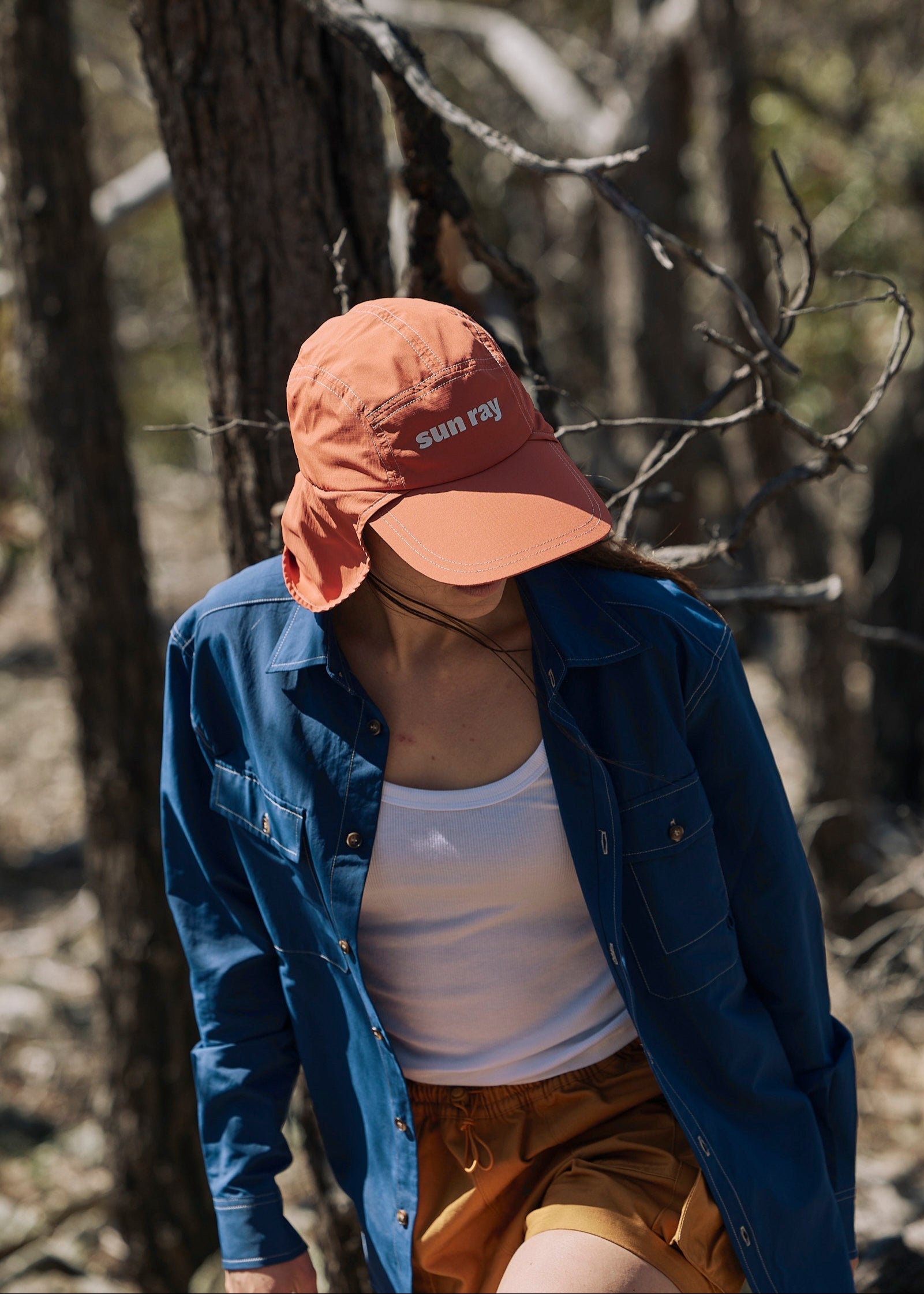 Person wearing a blue Sun Ray UPF50+ sun protection overshirt sun shirt