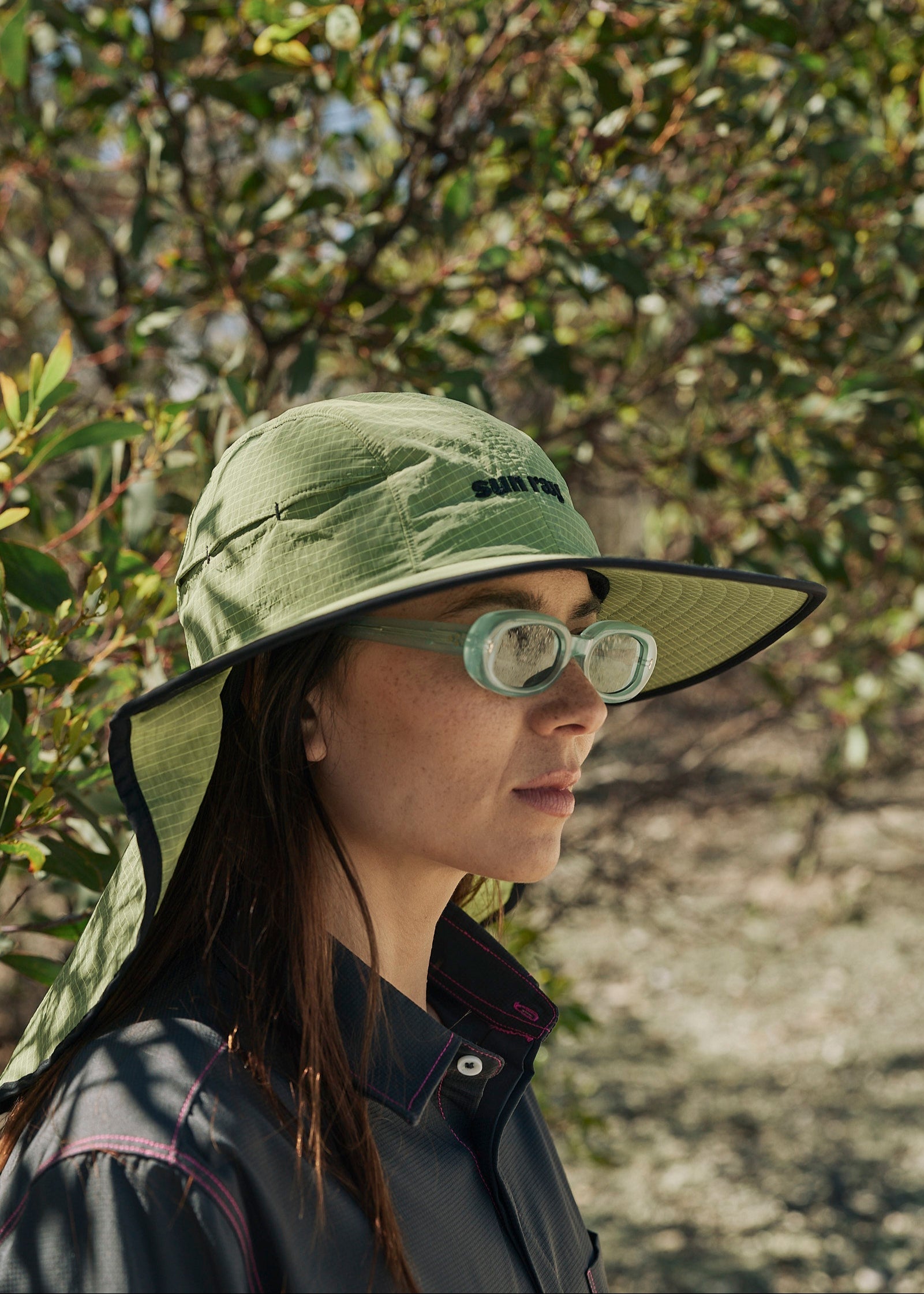 Person wearing a sun ray green sun protection UPF50+ seriously shady hat with neck cover