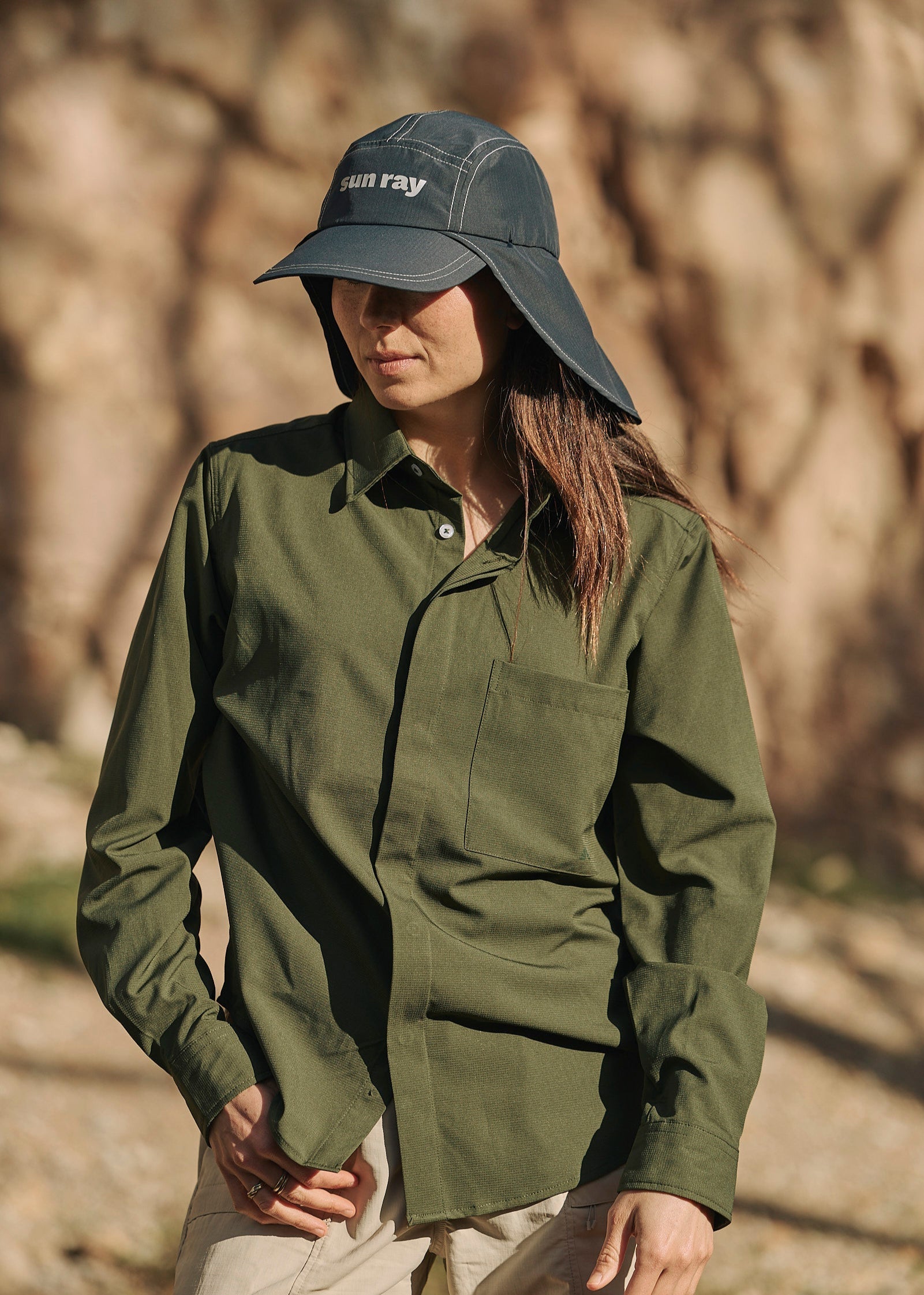 Person wearing olive green Sun Ray UPF50+ sun protection sun shirt