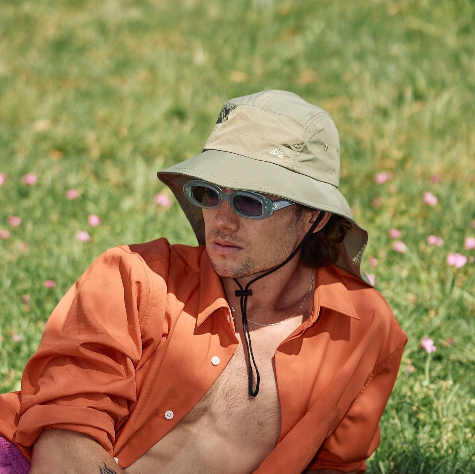A sun smart man wears the Sun Ray UPF50+ Sun Protection Clothing long sleeve shirt burnt orange and mullet brimmer hat in Australia.