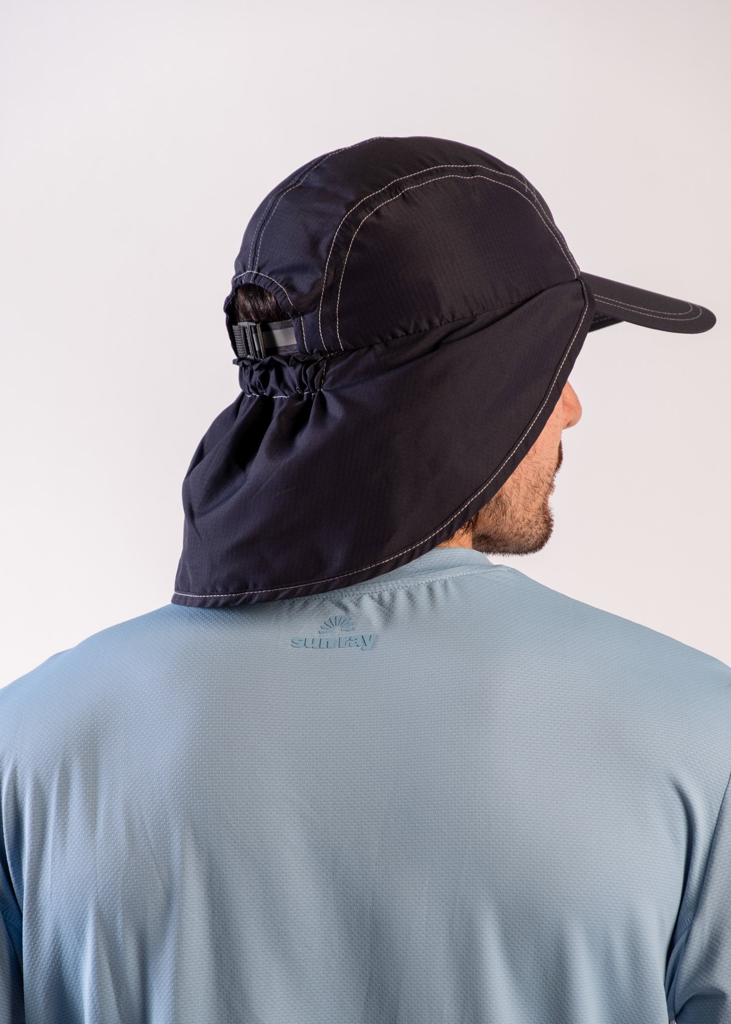 Person wearing a UPF50+ navy legionnaire hat