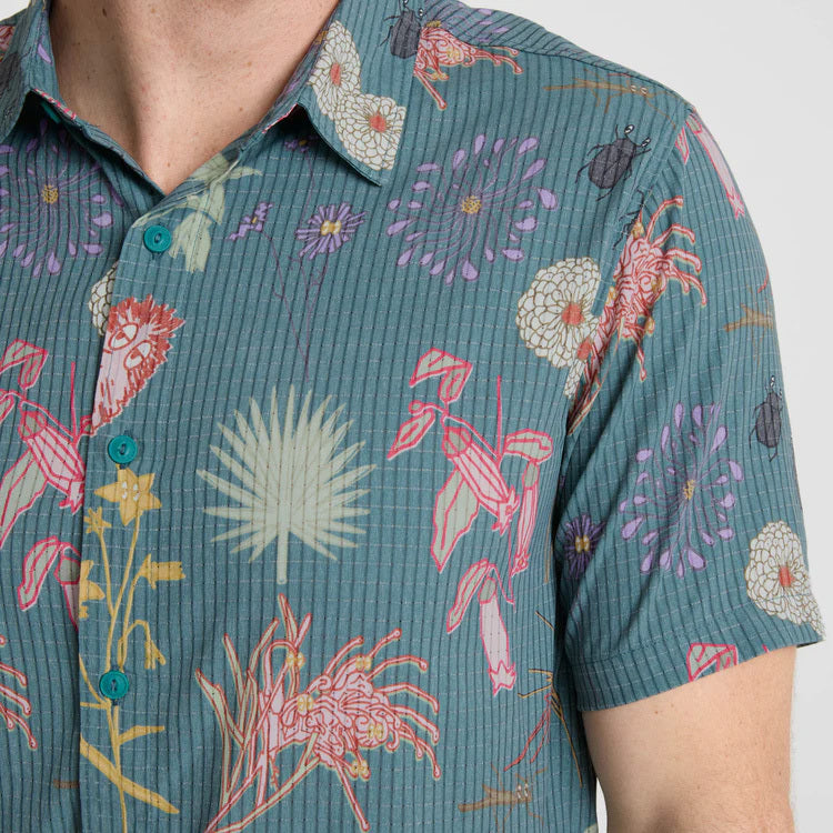 Close-up of a rugged button on outdoor adventure gear, embodying durability and style for Roark explorers.