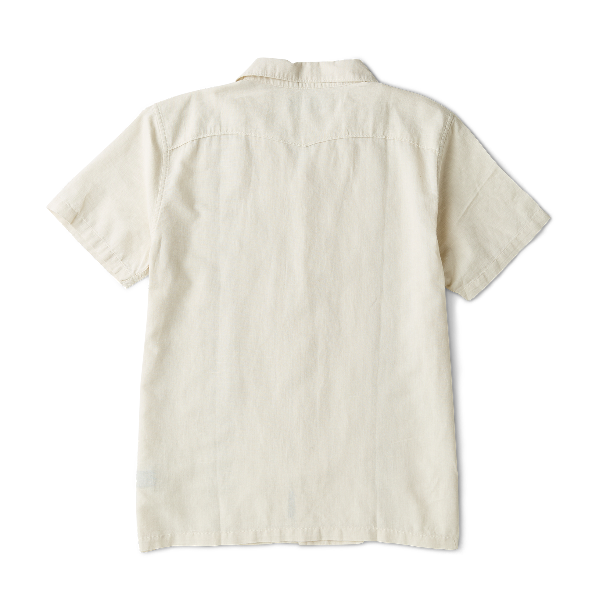 Close-up of a white shirt detailing intricate sleeve stitching, rugged buttons, and a stylish collar, perfect for outdoor adventures and travel.