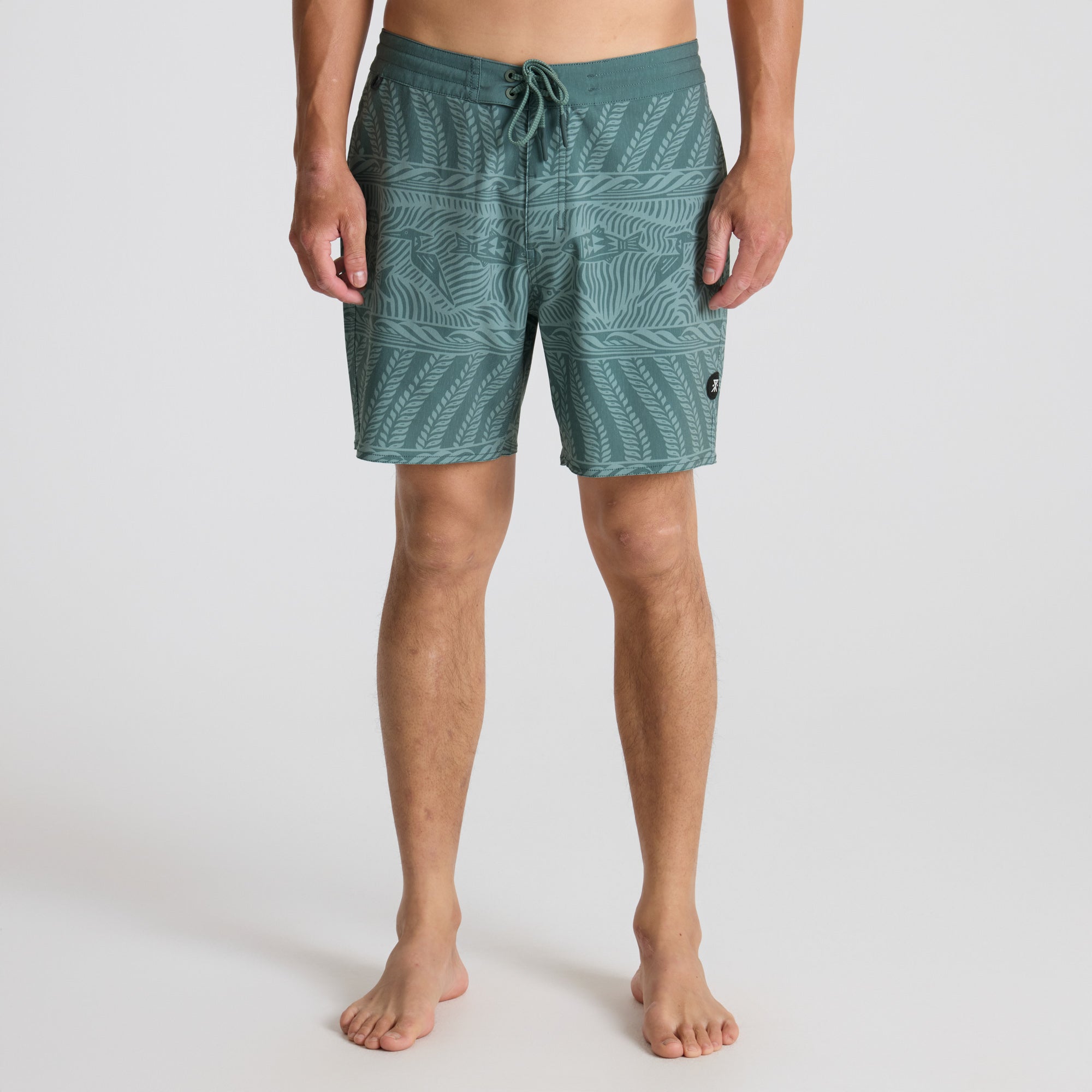 Stylish Roark boardshorts and trunks designed for outdoor adventures and tropical escapades, displayed in a natural setting.