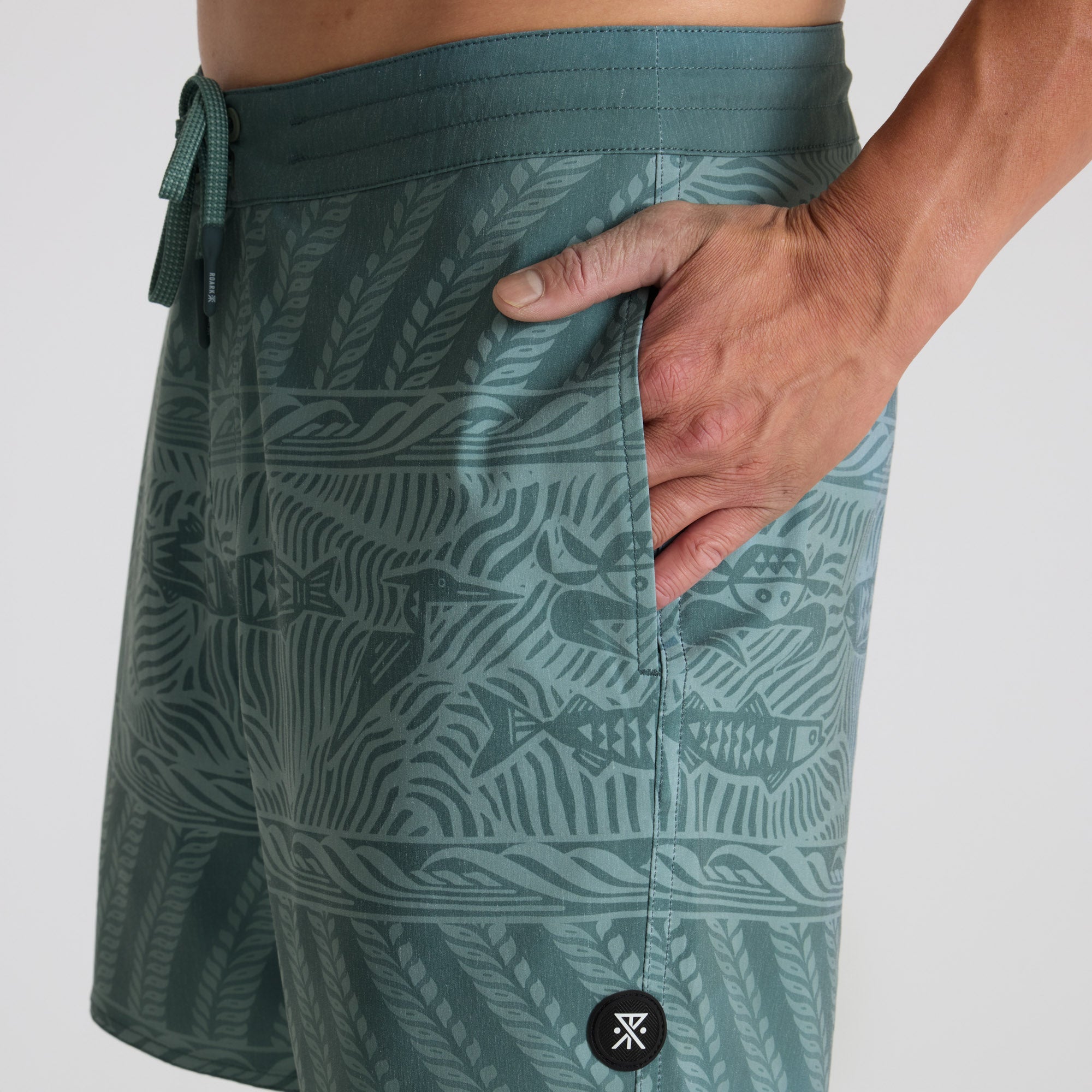 Stylish boardshorts displayed for an outdoor adventure, perfect for travel and exploring new destinations.