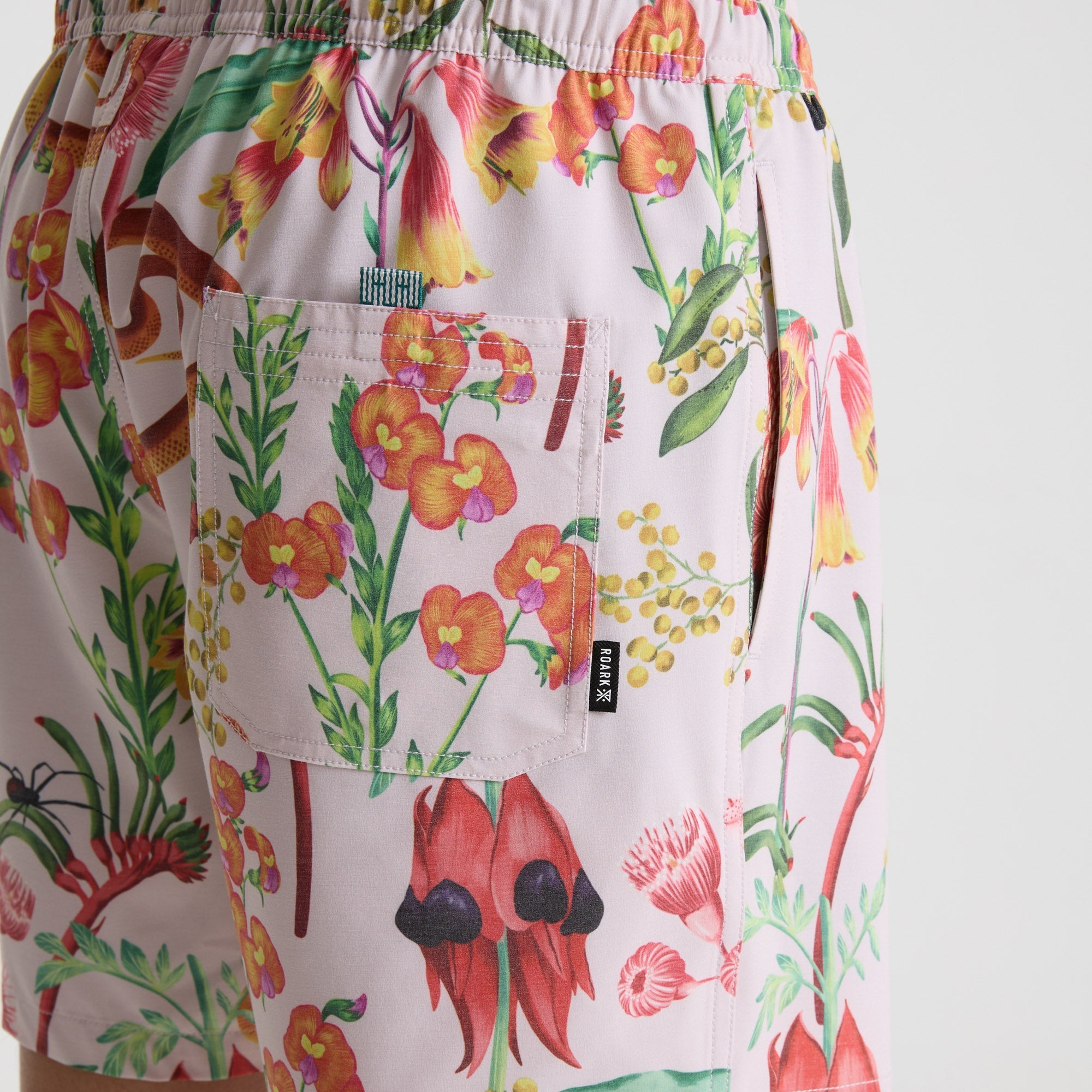 Vibrant pink Roark boardshorts ideal for outdoor adventures and water activities.