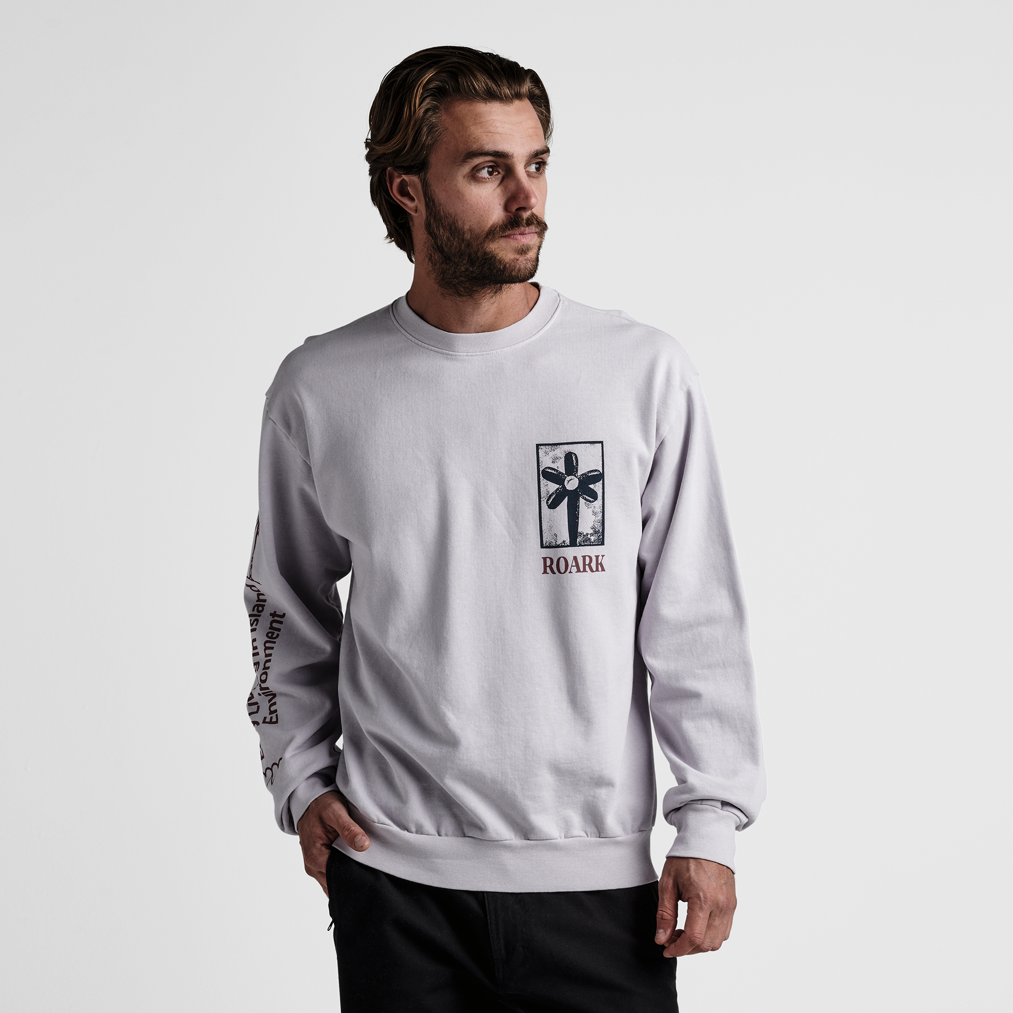 The model of Roark men's Artifacts Of Adventure Crew Sweatshirt - Dusty Lilac