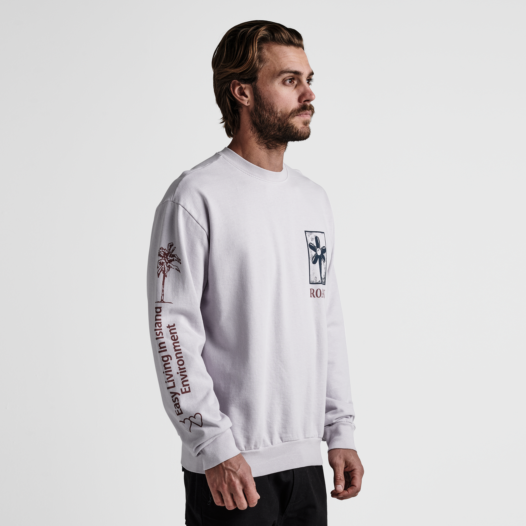 The model of Roark men's Artifacts Of Adventure Crew Sweatshirt - Dusty Lilac