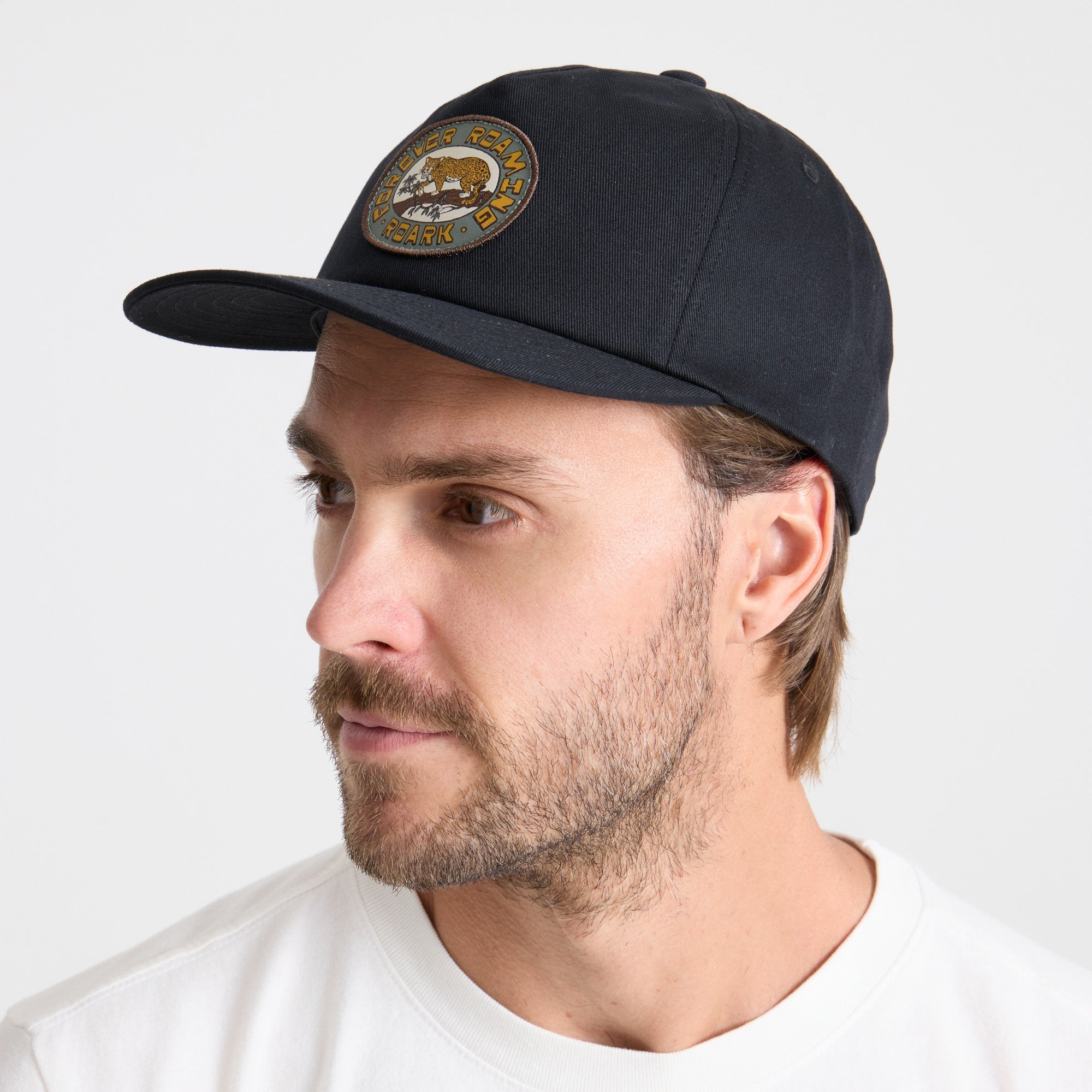 Stylish black baseball cap from Roark, designed for outdoor adventures and travels.