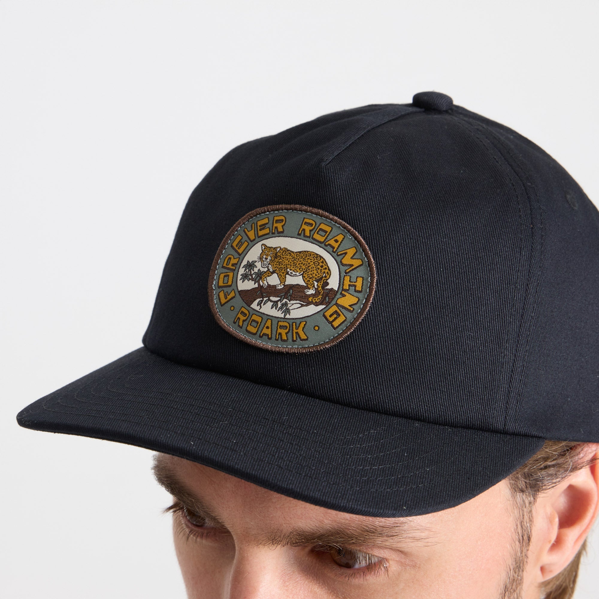 Versatile black baseball cap perfect for outdoor adventures and travel, from Roark's collection