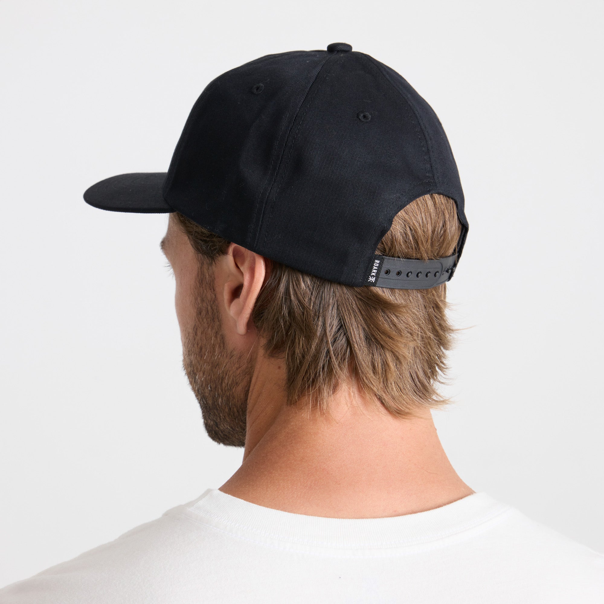 Stylish black cricket cap perfect for outdoor adventures and travel by Roark.