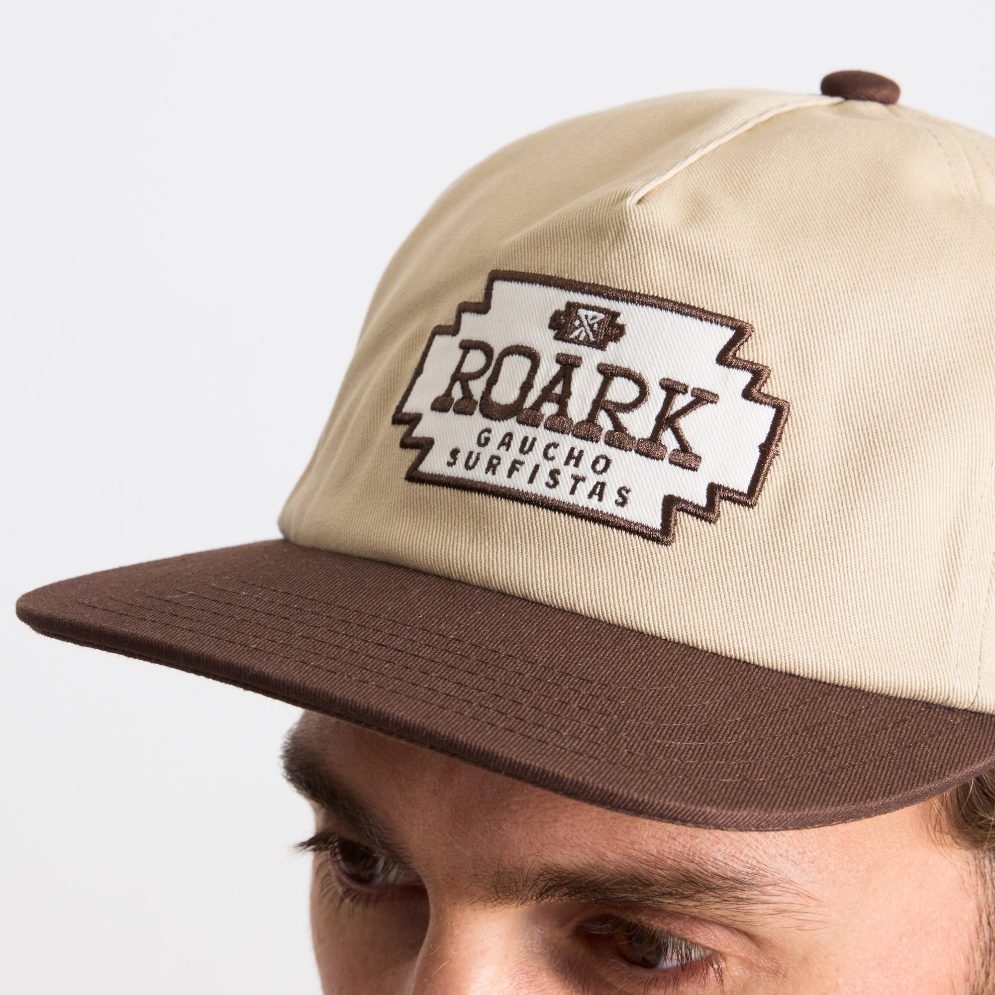 Close-up of a Roark label on adventure gear, featuring precise details and quality craftsmanship.