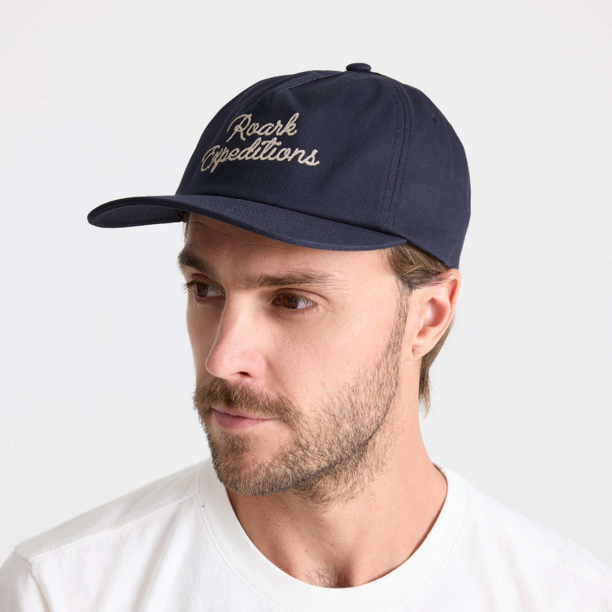 Stylish navy denim cricket cap by Roark, perfect for outdoor adventures and travel.