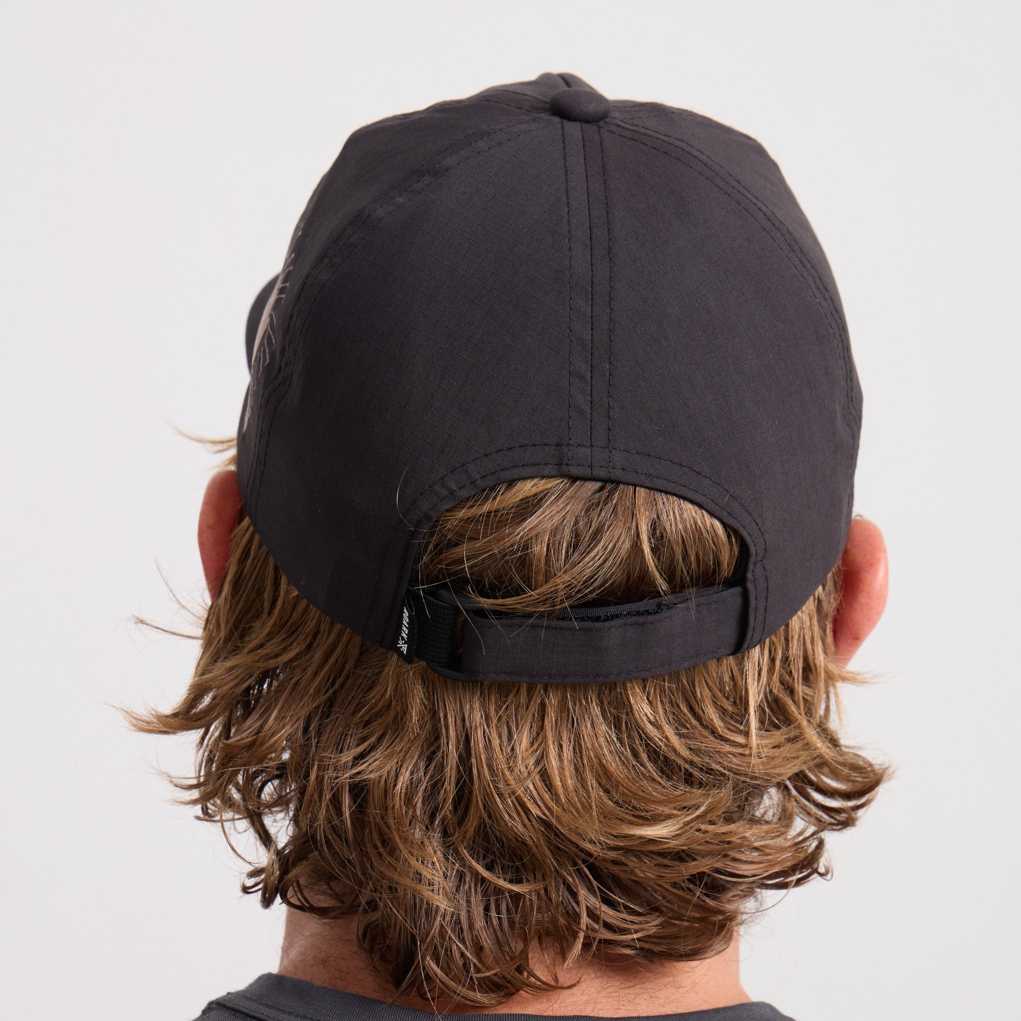 Stylish black Roark adventure cap ideal for travel and outdoor activities