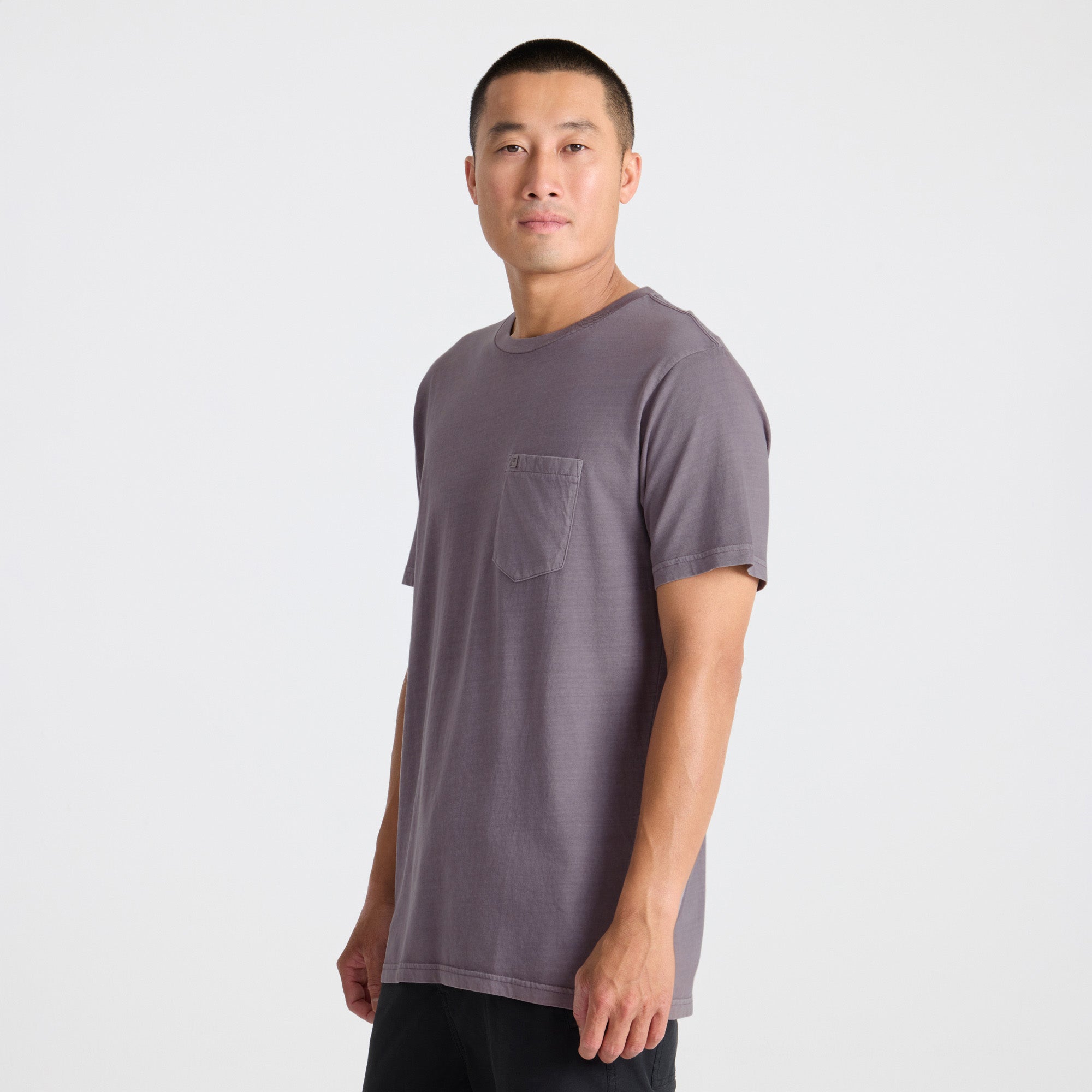 Man wearing a gray t-shirt on a white background