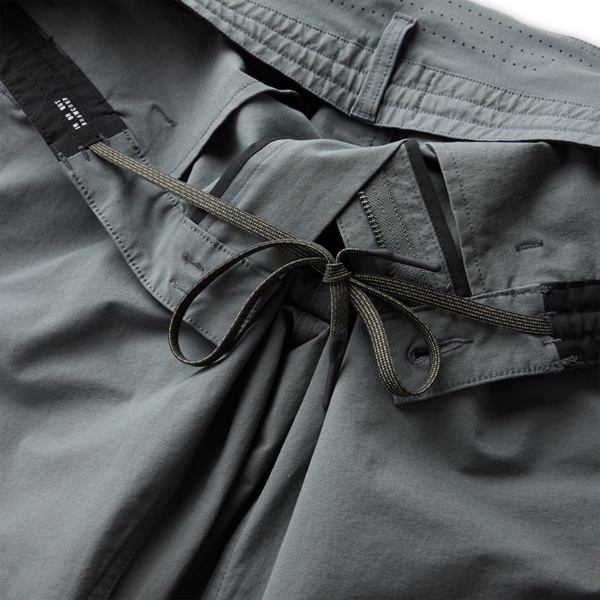 Versatile grey adventure pants with pockets, perfect for outdoor activities by Roark