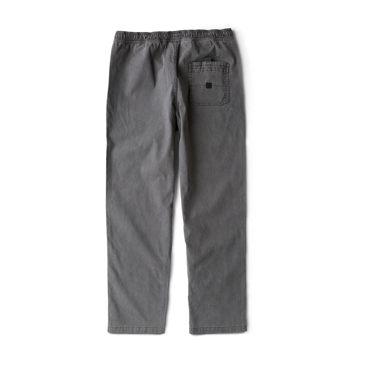 Close-up of the durable details on Roark outdoor apparel featuring pockets, buttons, and zippers, designed for adventure and travel.