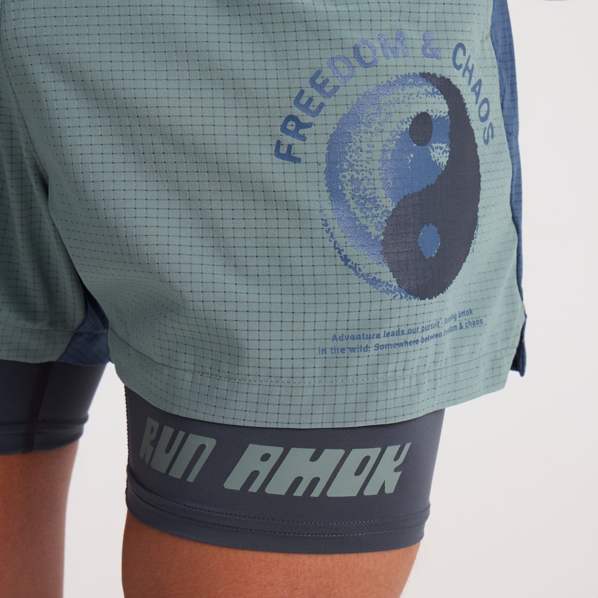 Man wearing Roark active shirt and Bermuda shorts while exploring rugged terrain