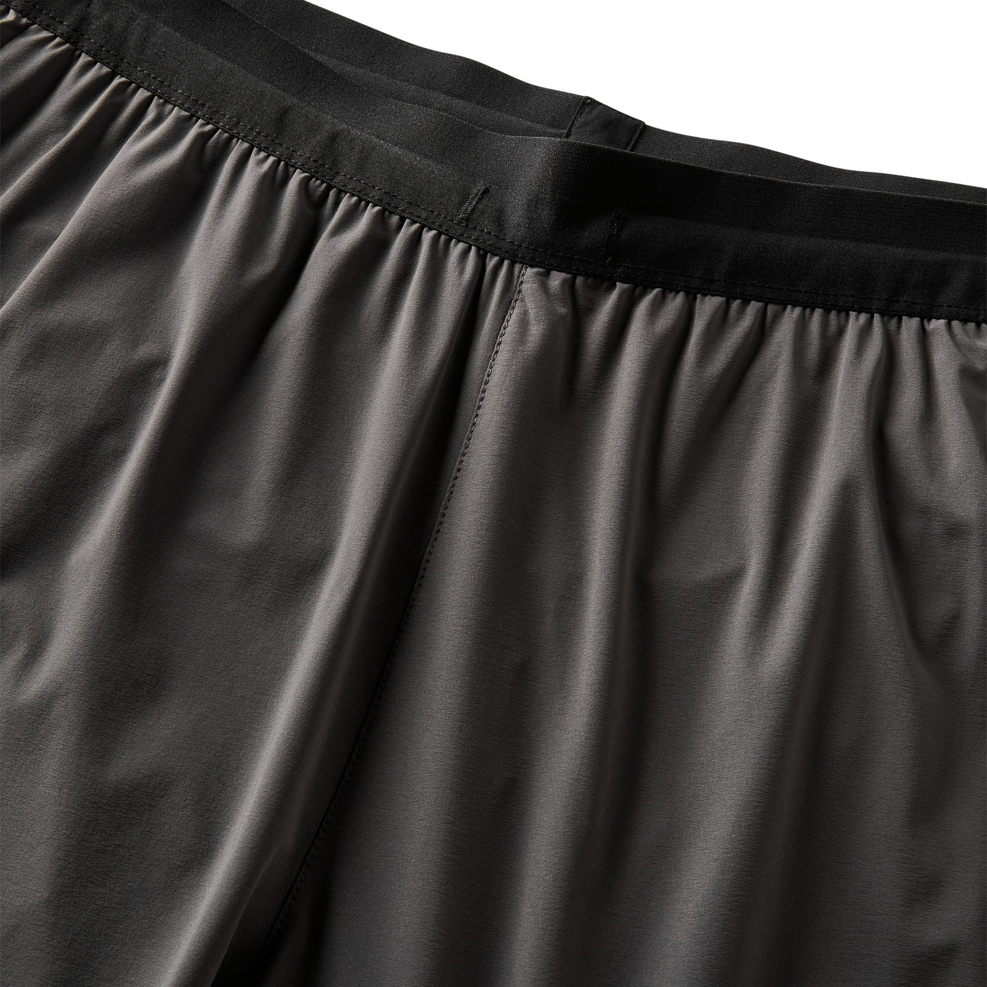 Detailed view of fabric texture on performance shorts, emphasizing quality and breathability.