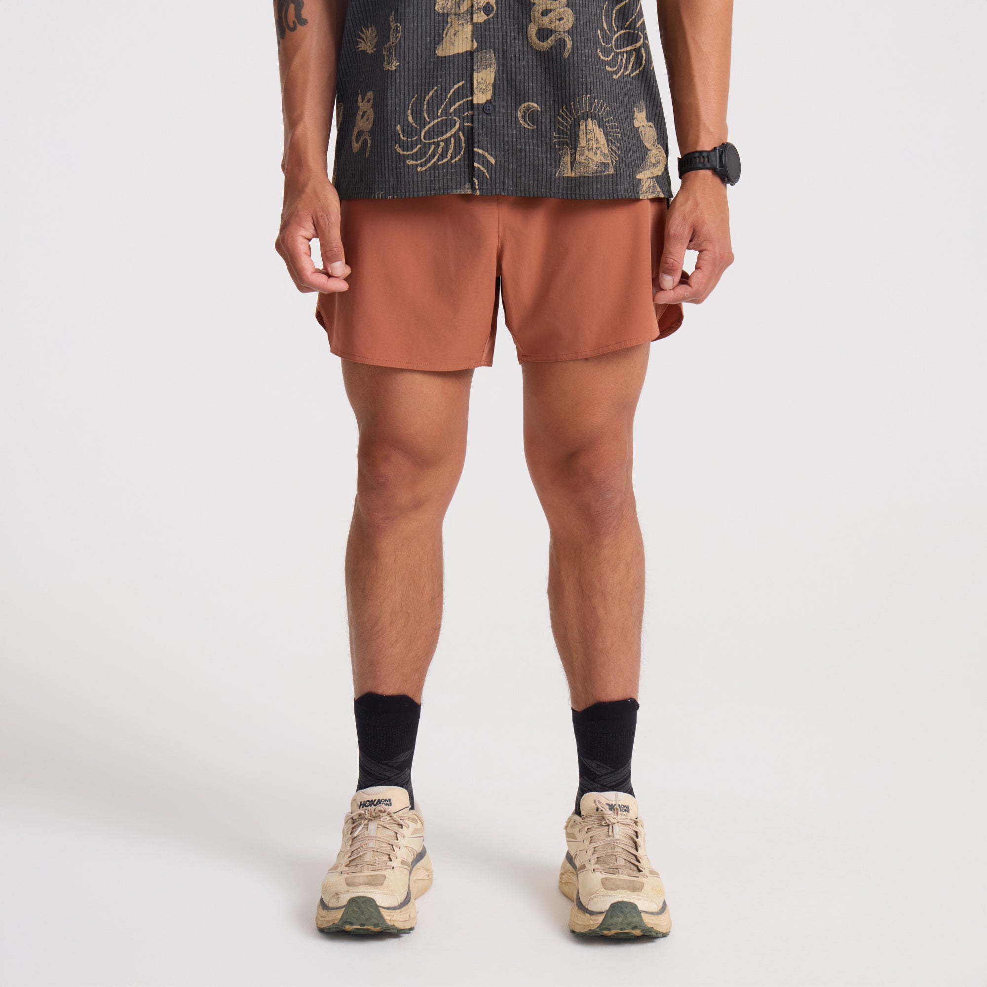 Assortment of Roark adventure-ready shorts including active shorts, boardshorts, Bermuda shorts, and trunks, displayed with a view of a calf, embodying the spirit of outdoor exploration and travel.