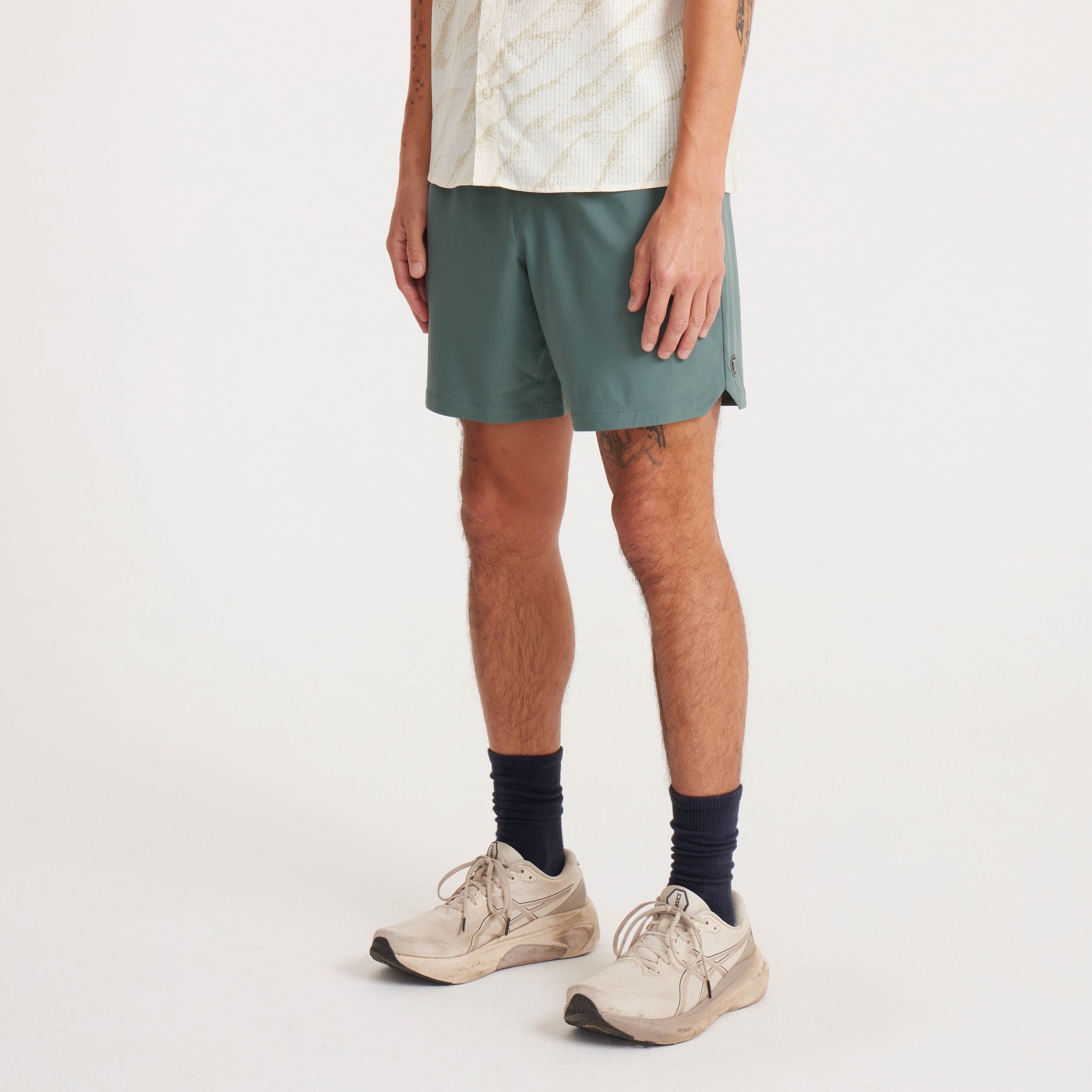 Front view of men's green shorts with an athletic fit and lightweight, breathable fabric for maximum comfort.