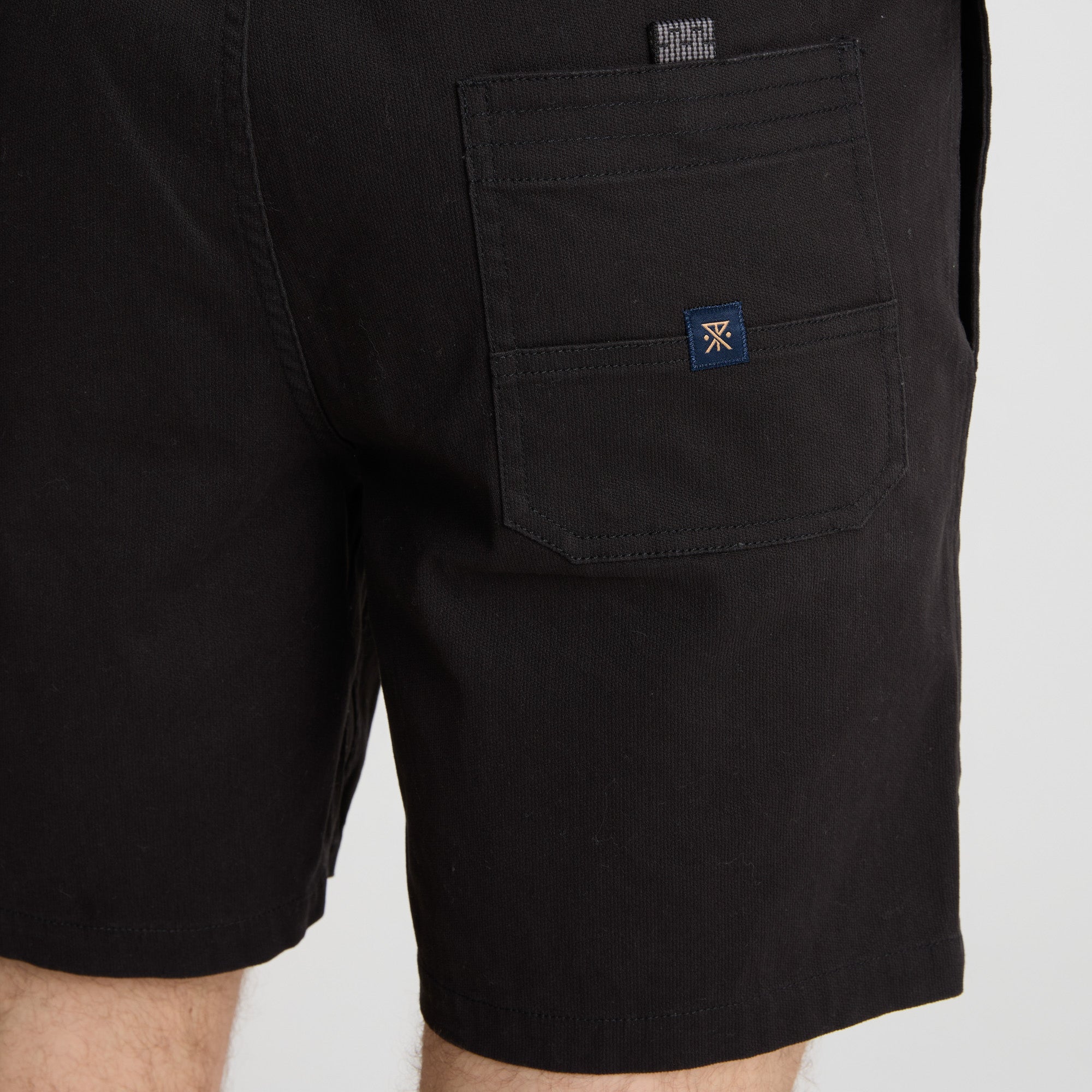 Adventure-ready Roark apparel displayed in an outdoor setting, blending with the natural scenery.