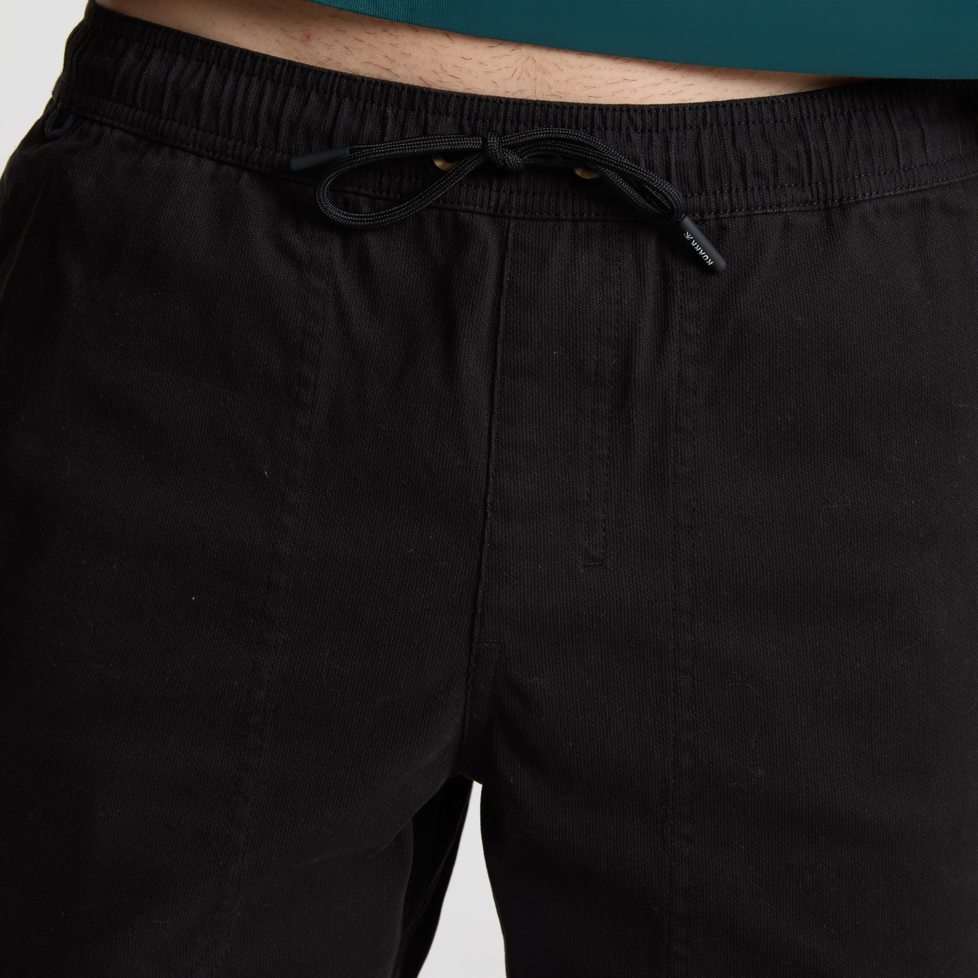 Adventure-ready man wearing Roark outdoor gear exploring a rocky landscape